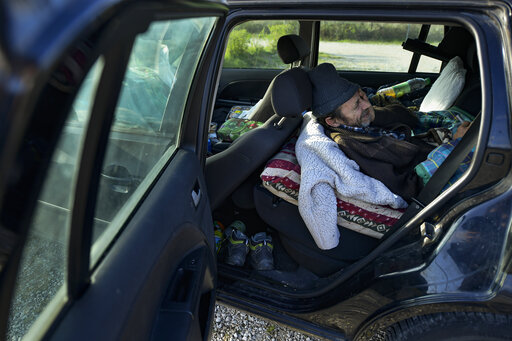 Ap Photos: Cars Become Home For Spain’s Pandemic Casualties
