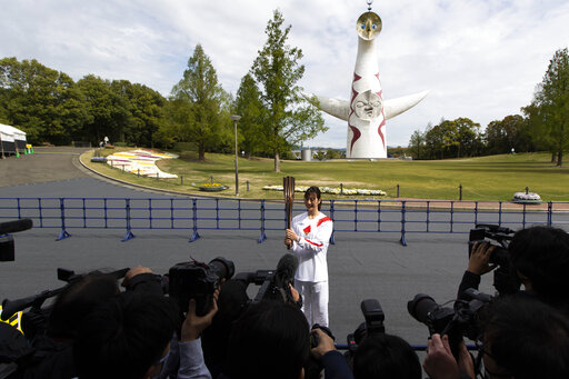 Olympic Torch Runs Through Empty Park In Osaka As Cases Rise