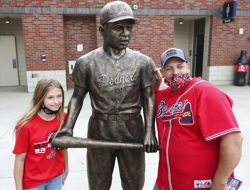 Dodgers Gather At Jackie Robinson Statue To Pay Respects