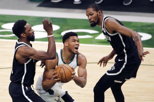 Bucks Rally In 4th To Beat Nets 124 118, Clinch Playoff Spot