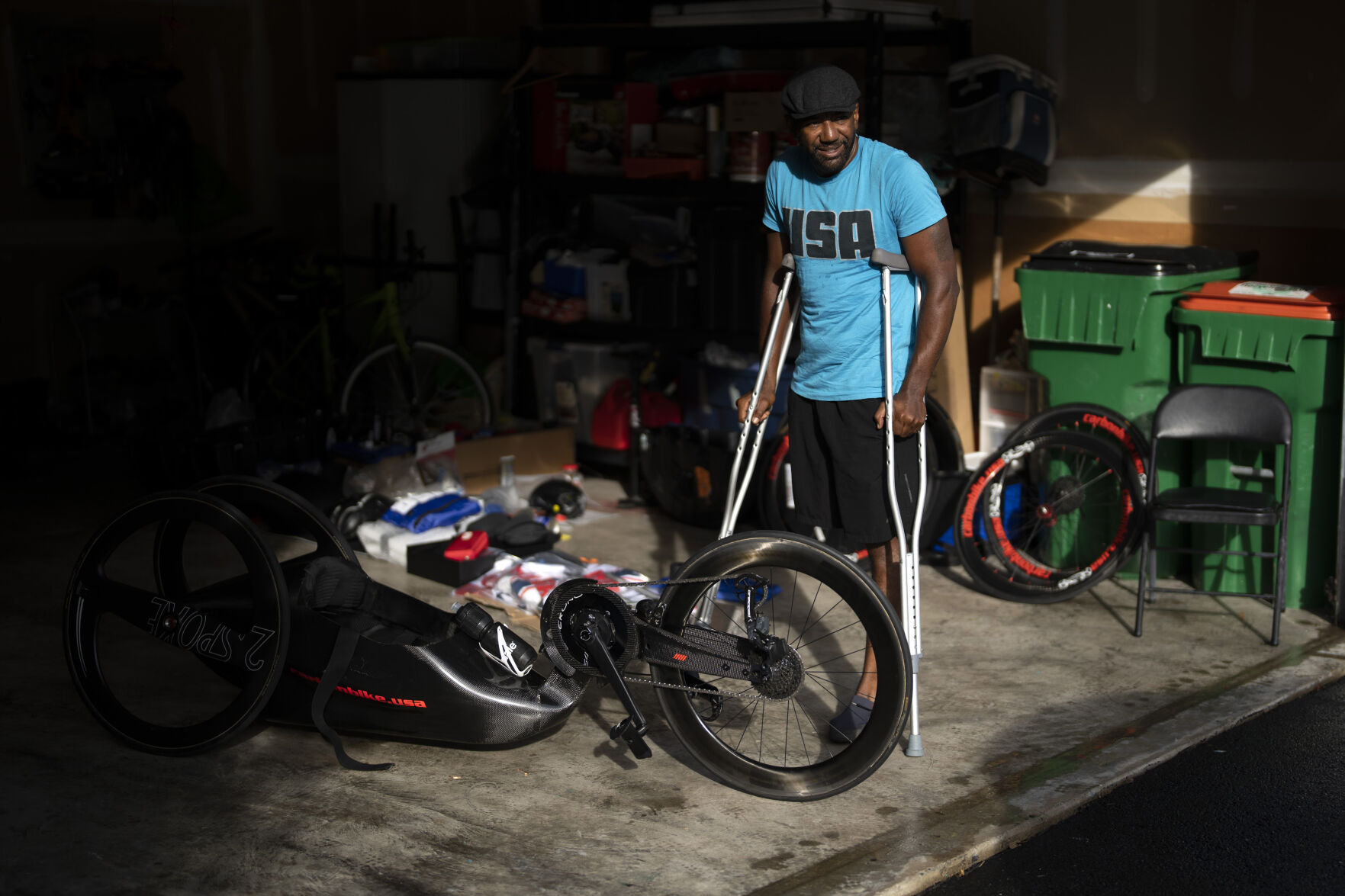 <p>Freddie De Los Santos stands next to his bicycle before his daily training in Hopewell Junction, N.Y., on Wednesday, Aug. 19, 2021. His life changed in 2009, when a rocket-propelled grenade ripped into his vehicle in an Afghan village. He remembers his beard burning, and grabbing his leg after it was ripped off by the blast. (AP Photo/Emilio Morenatti)</p>
