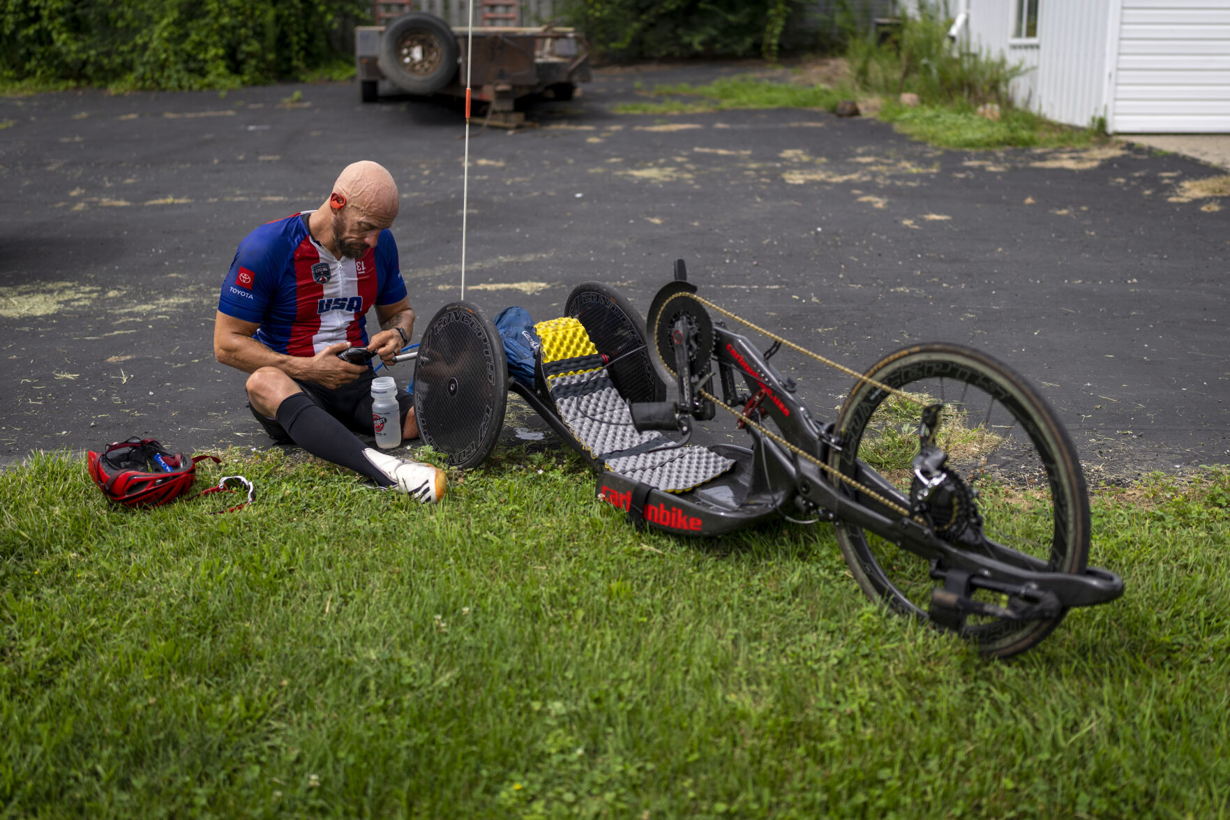 <p>Tom Davis takes a break during his riding session as part of his daily training in Fremont, Ind., Tuesday, Aug. 17, 2021. Twenty years after the attacks of Sept. 11, and just days after the Taliban took control of Kabul, Davis is one of the small group of American combat veterans competing in the Tokyo Paralympics -- a corps of elite athletes who have triumphed over catastrophic injuries they suffered in Iraq and Afghanistan. (AP Photo/Emilio Morenatti)</p>