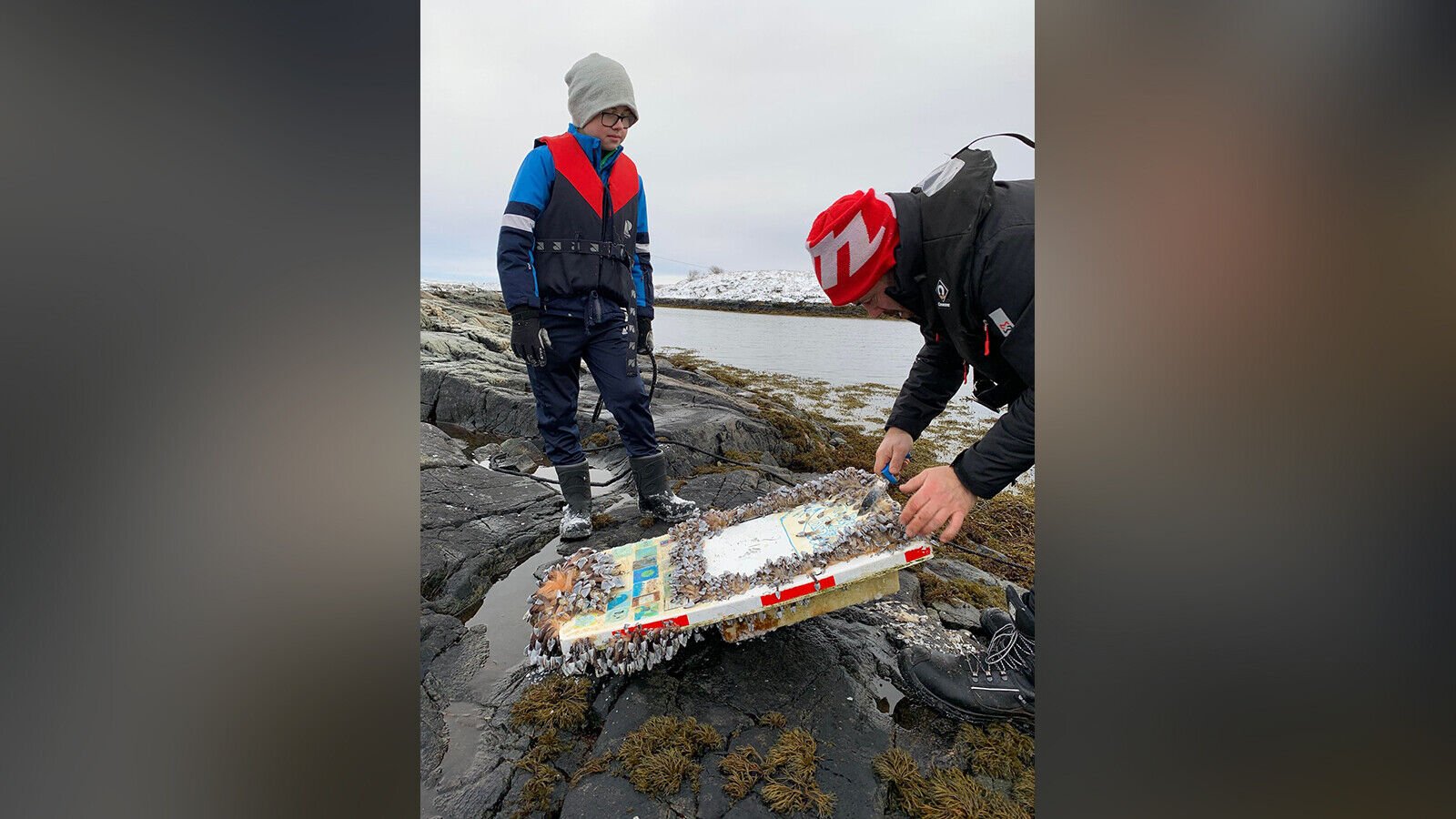 <p>Karel Nuncic, left, took the vessel to his 6th grade class to open it with his classmates.</p>