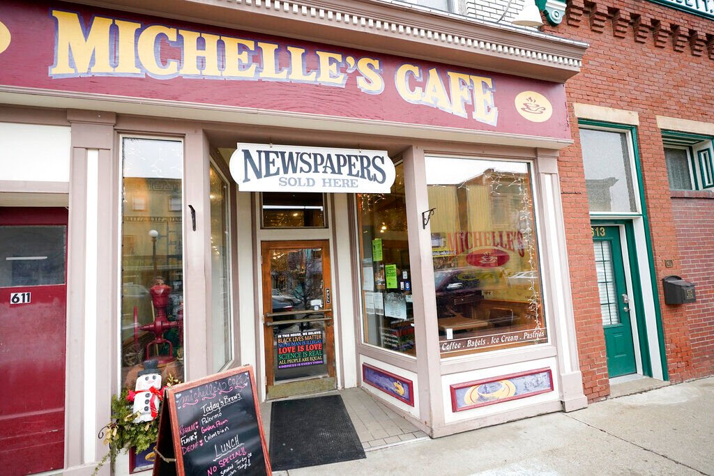 <p>Signs mark the entrance to Michelle's Cafe along Main Street, in Clarion, Pa., Saturday, Feb. 12, 2022. </p>