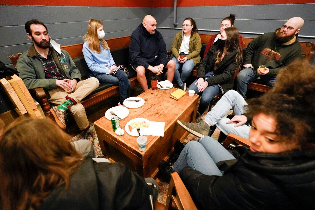 <p>Democratic candidate for the Pennsylvania U.S.senate seat in the 2022 primary election, Lt. Gov. John Fetterman, center, talks with people during a campaign stop at the Mechanistic Brewery, in Clarion, Pa., Saturday, Feb. 12, 2022.</p>
