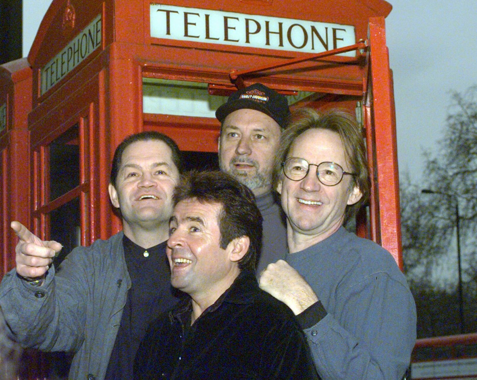 <p>Members of the Monkees, from left, Micky Dolenz, Davy Jones, Mike Nesmith and Peter Tork pose in front of a telephone booth in London as they announce a tour on Jan. 10, 1997.</p>
