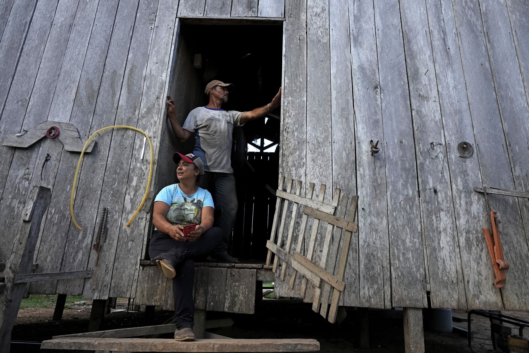 <p>Rubber-tapper Luzineide Marques da Silva and her husband, Eneas Souza Campos, appear Dec. 6 at the door of their house in the Chico Mendes Extractive Reserve, in Xapuri, Acre state, Brazil.</p>