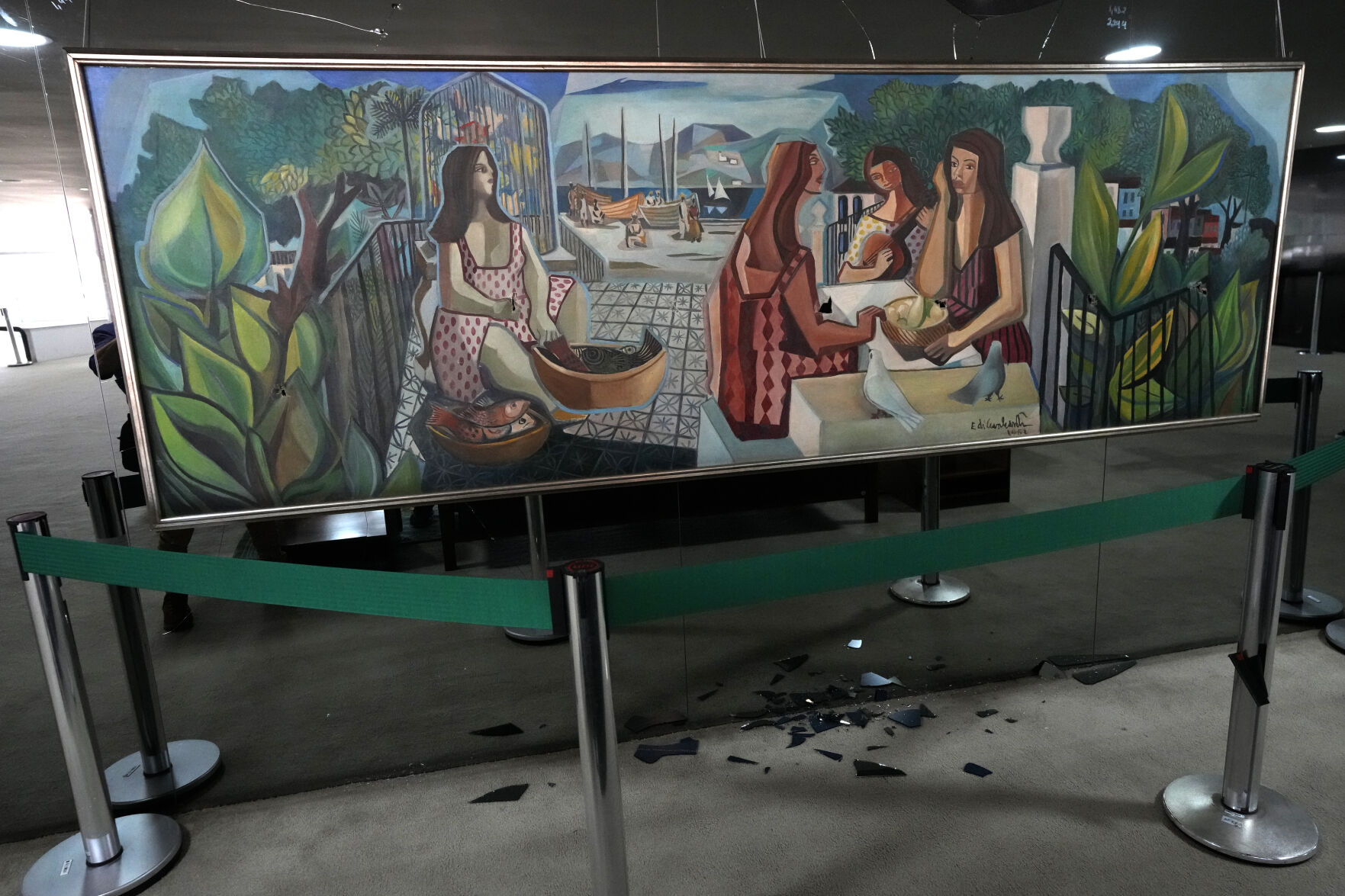 <p>The damaged artwork titled "As Mulatas" by Brazilian artist Di Cavalcanti is displayed Jan. 11 in the entrance hall of the presidential office at Planalto Palace, after the storming of public buildings by supporters of former President Jair Bolsonaro in Brasilia, Brazil.</p>