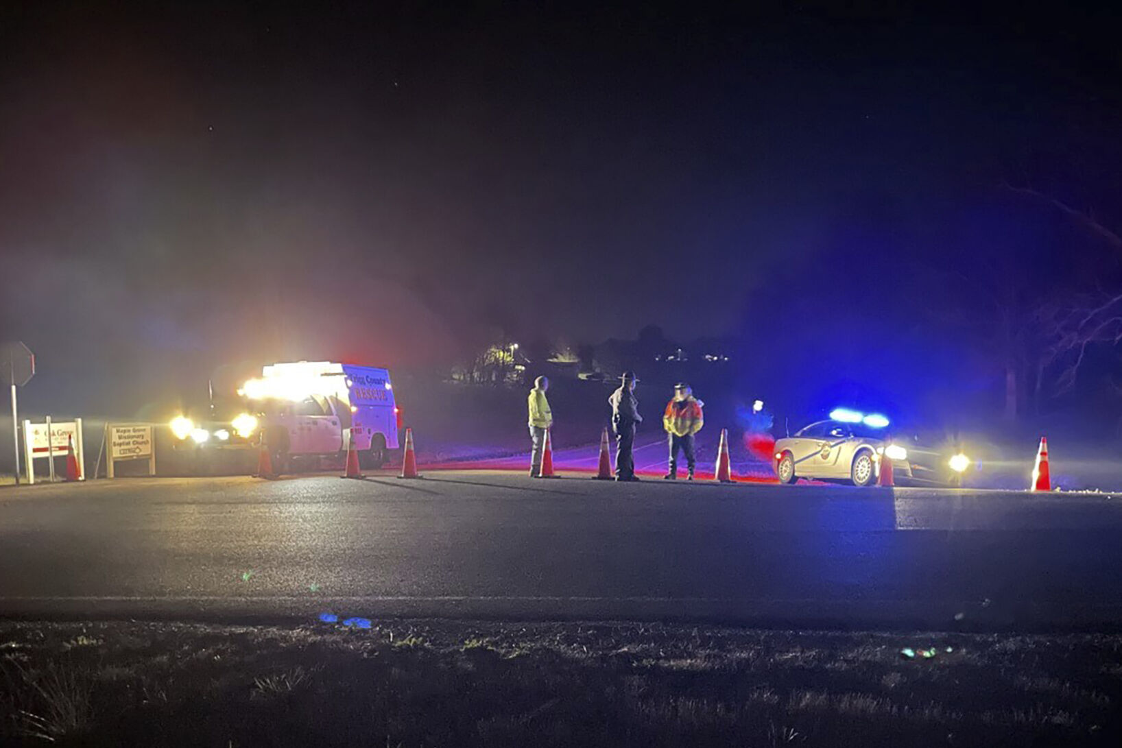 <p>Emergency responders are seen near a site where two military helicopters crashed Wednesday night during a routine training mission in Trigg County, in southwestern Kentucky, on March 30, 2023. (Brandon Smith/WSMV-TV via AP)</p>