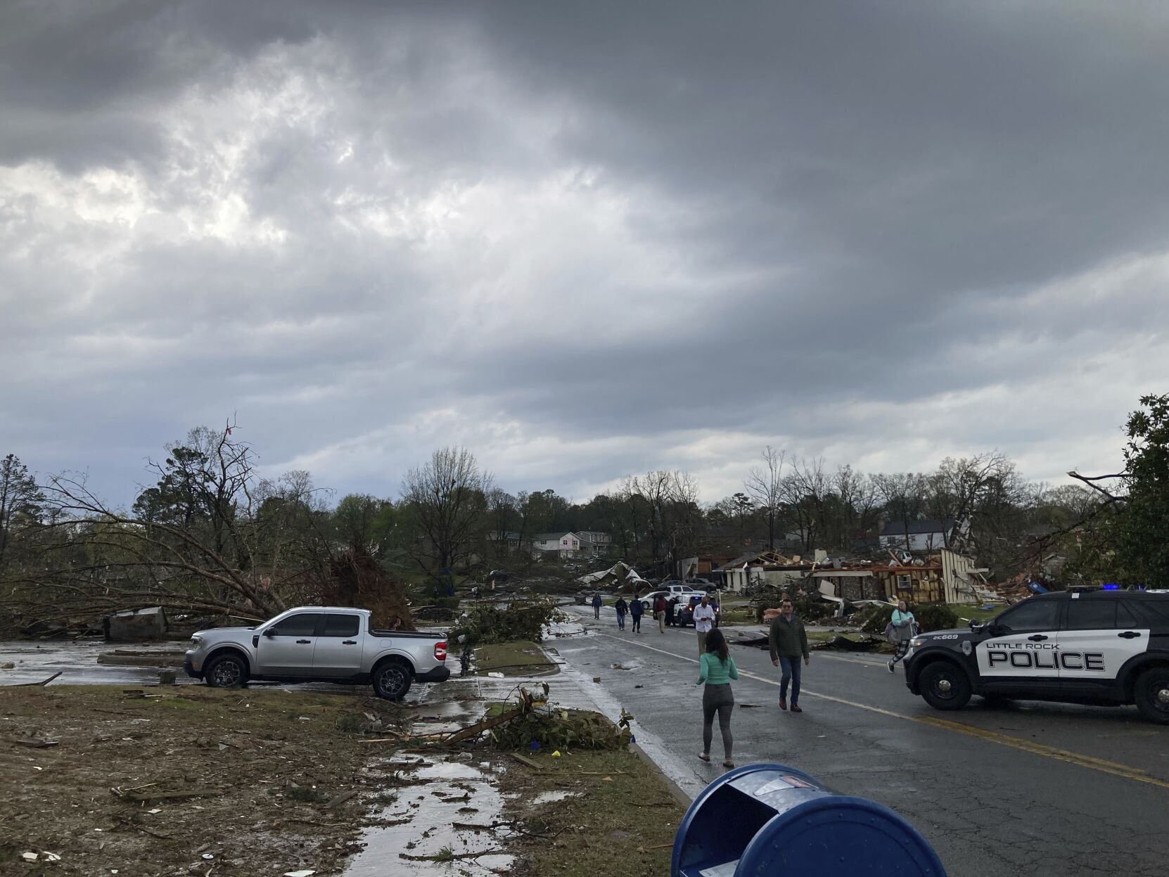 <p>Residents mill about after severe storm swept through Little Rock, Ark. on Friday.</p>