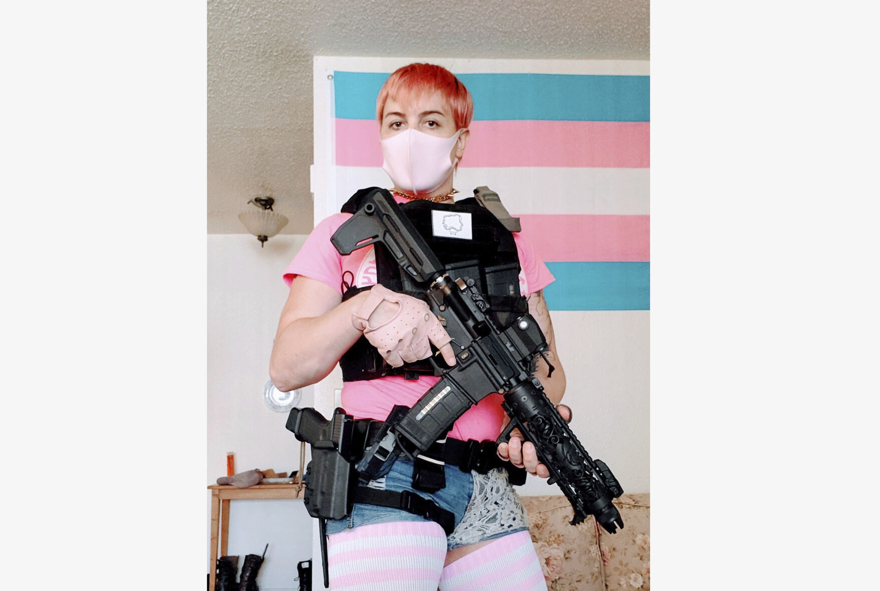 <p>This 2020 photo provided by Alana McLaughlin shows McLaughlin, an MMA fighter, holding a gun. The image was misrepresented on social media on March 28, 2023, in the wake of a school shooting in Nashville. (Courtesy of Alana McLaughlin via AP)</p>