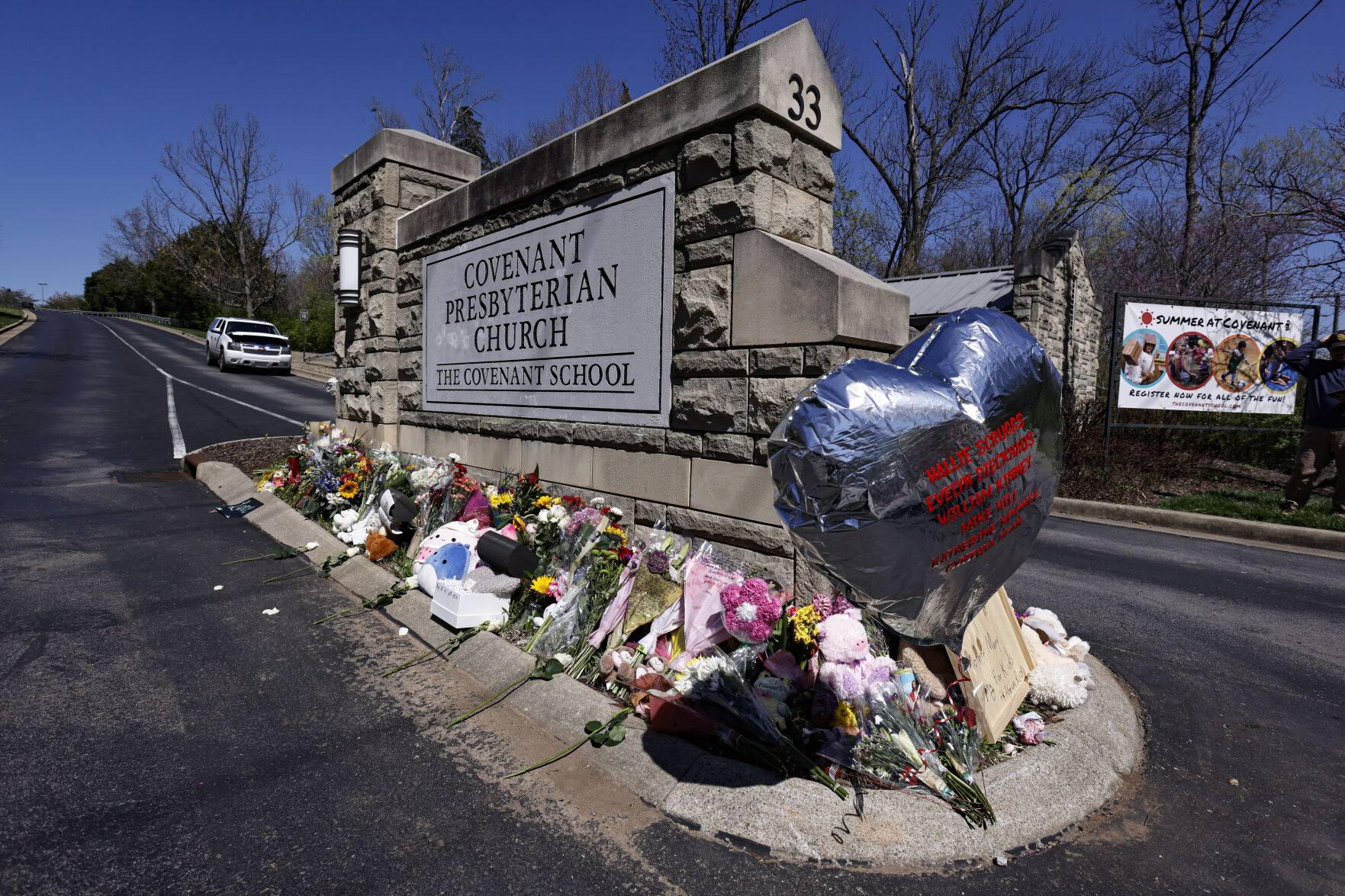 <p>A balloon with names of the victims is seen at a memorial at the entrance to The Covenant School on Wednesday, March 29, 2023, in Nashville, Tenn. (AP Photo/Wade Payne)</p>