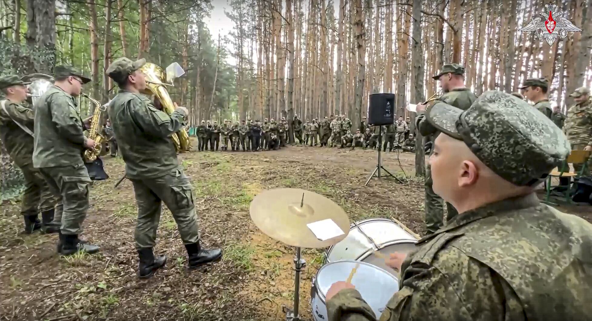 <p>In this image made from undated video released by Russian Defense Ministry Press Service on Sunday, artists of the Ural Brass Band and the Front Brigade of the Song and Dance Ensemble of the Central Military District perform during a concert at the advanced area of the special operation at an undisclosed location.</p>