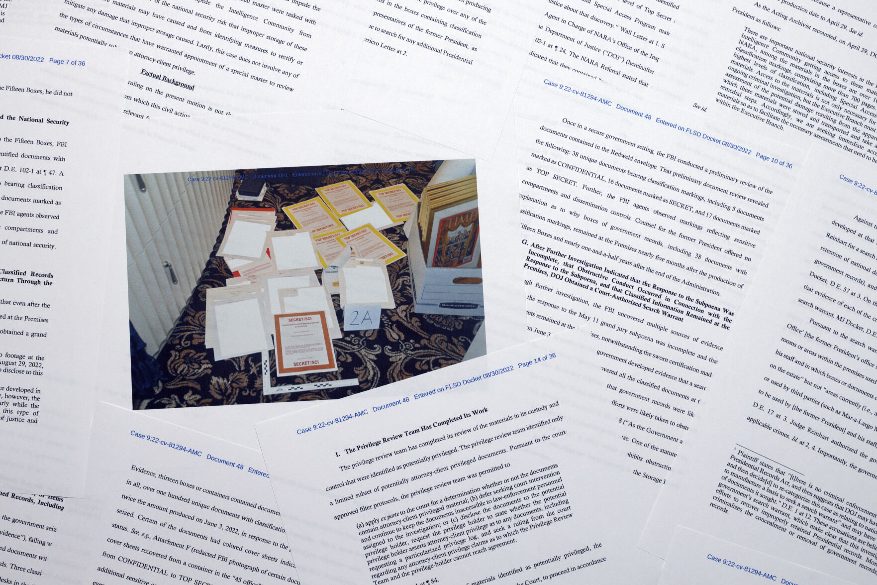 <p>Pages from a Department of Justice court filing on Aug. 30, 2022, in response to a request from the legal team of former President Donald Trump for a special master to review the documents seized during the Aug. 8 search of Mar-a-Lago, are photographed early Aug. 31, 2022. </p>