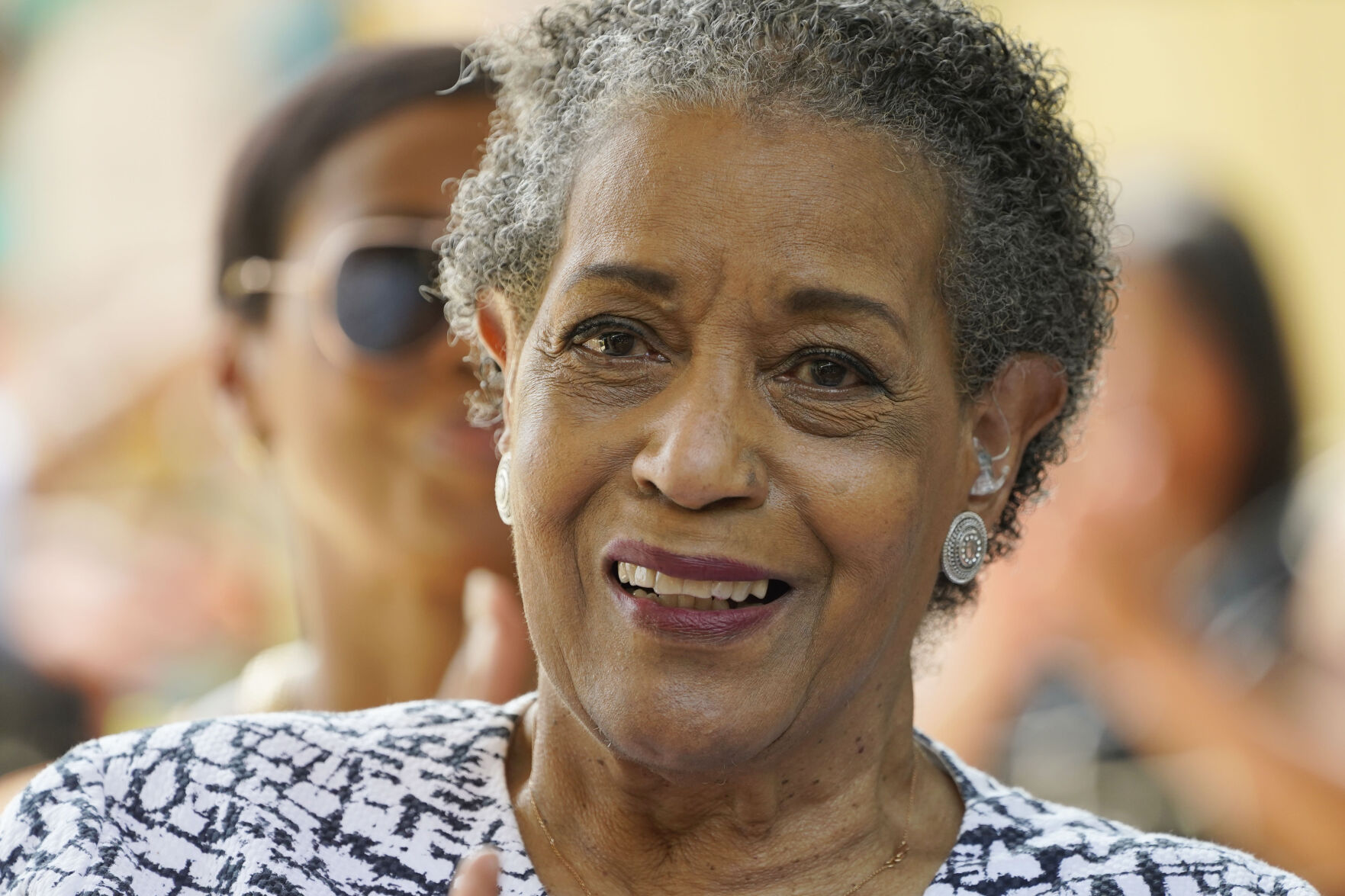 <p>Myrlie Evers, civil right leader and widow of slain civil rights icon Medgar Evers, acknowledges the audience applause after the unveiling of the new park sign for Medgar and Myrlie Evers Home National Monument on Thursday in Jackson, Miss.</p>