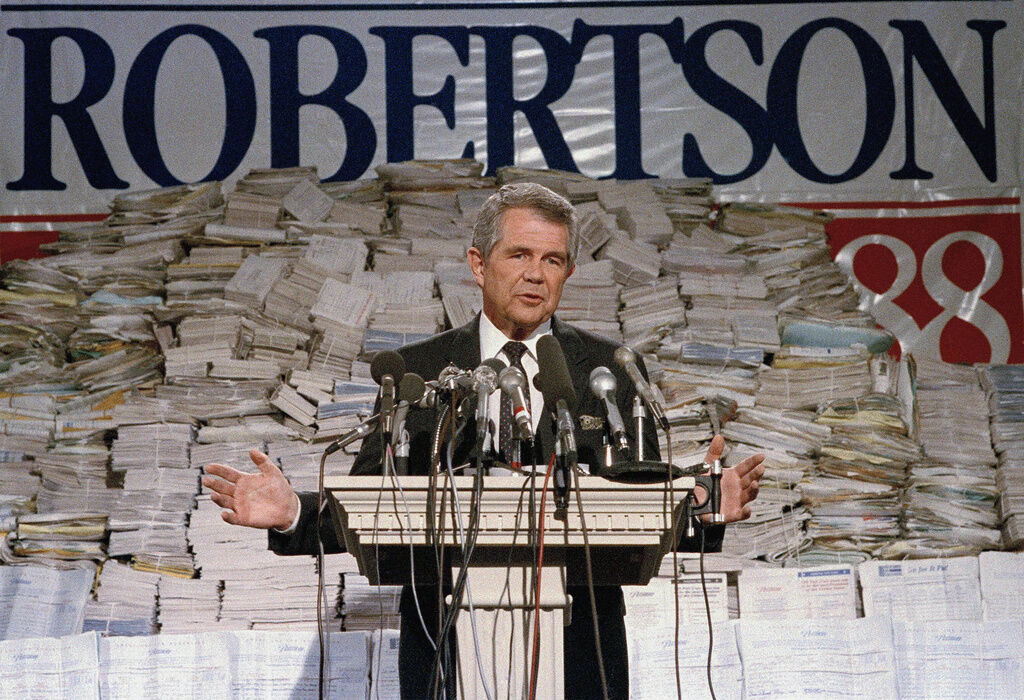 <p>FILE - Pat Robertson, stands in front of stacks of signatures as he announced his intentions to collect a total of 7 million signatures during a news conference on Sept. 15, 1987 in Chesapeake, Va. Robertson, a religious broadcaster who turned a tiny Virginia station into the global Christian Broadcasting Network, tried a run for president and helped make religion central to Republican Party politics in America through his Christian Coalition, has died. He was 93. Robertson's death Thursday, June 8, 2023 was announced by his broadcasting network. (AP Photo/Steve Helber, file)</p>