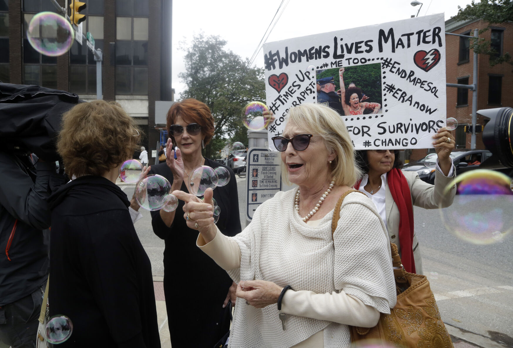 <p>Victoria Valentino, center, appears with a protester near the Montgomery County Courthouse on Sept. 24, 2018, in Norristown, Pa. </p>