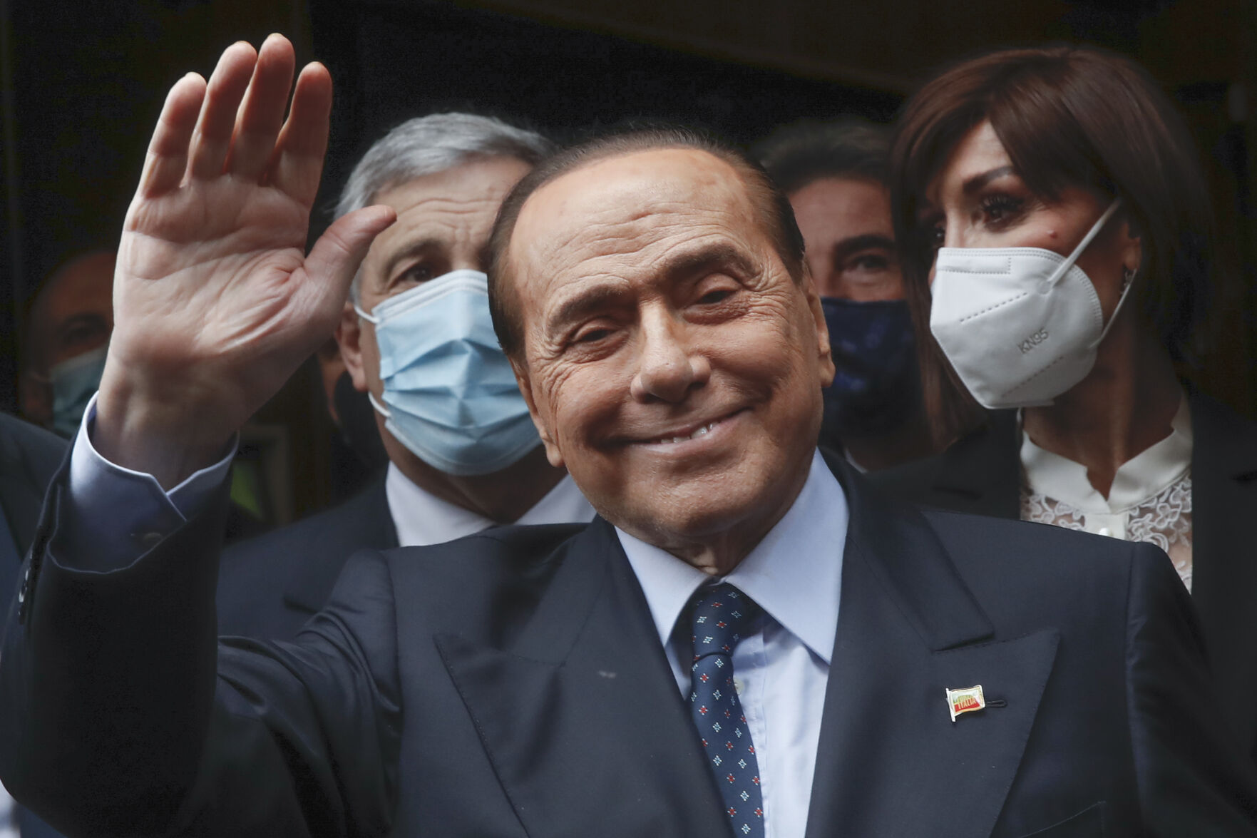 <p>Former Italian Premier Silvio Berlusconi waves to reporters as he arrives at the Chamber of Deputies to meet Mario Draghi on Feb. 9, 2021, in Rome.</p>