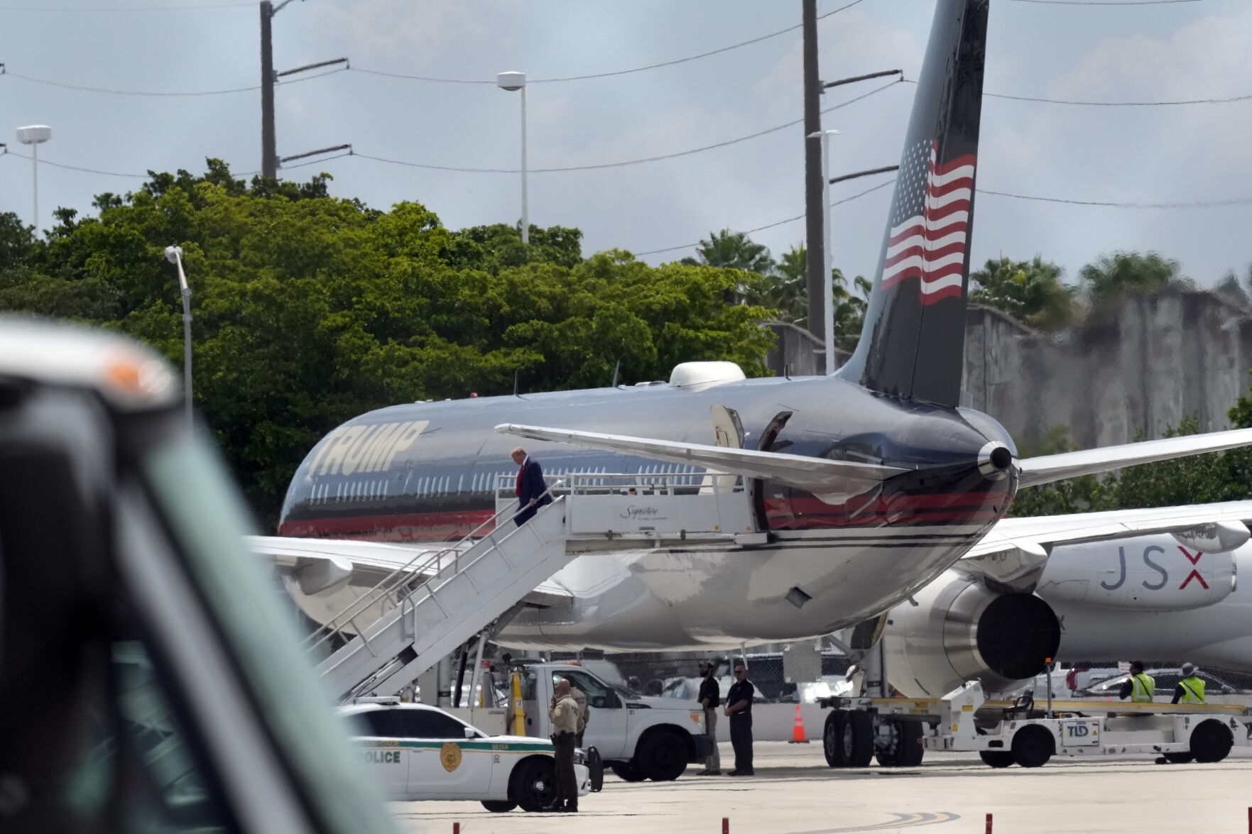 <p>Former President Donald Trump arrives Monday at Miami International Airport.</p>