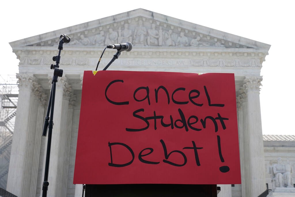 <p>A sign reading "cancel student debt" is seen outside the Supreme Court, Friday, June 30, 2023, as decisions are expected in Washington.</p>