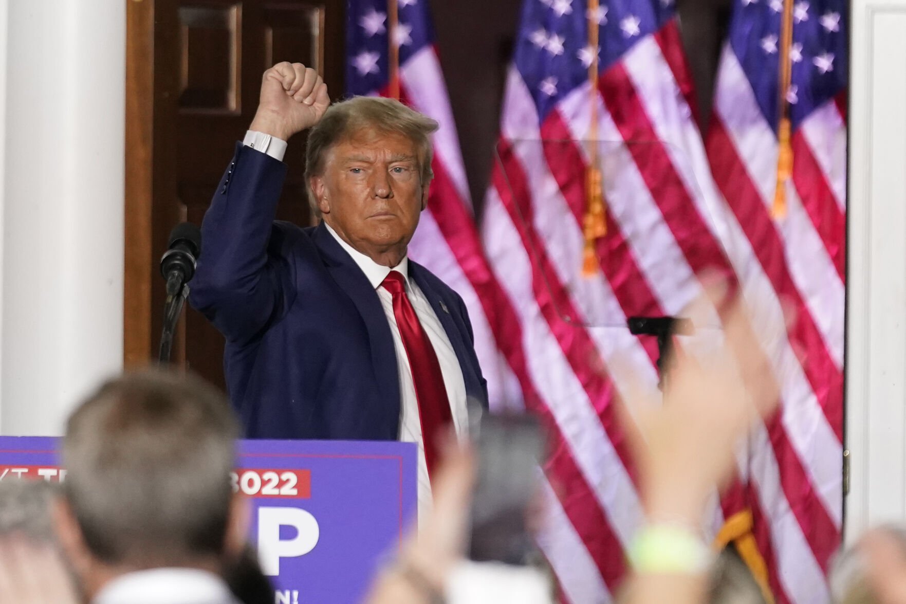 <p>FILE - Former President Donald Trump gestures after speaking at Trump National Golf Club in Bedminster, N.J., June 13, 2023, after pleading not guilty in a Miami courtroom earlier in the day to dozens of felony counts that he hoarded classified documents and refused government demands to give them back. An onscreen headline on Fox News Channel called President Biden a “wannabe dictator” who sought to have his political rival arrested. It was shown on Fox Monday night, beneath a split-screen image of former President Donald Trump speaking to supporters live and Biden speaking earlier at the White House.</p>