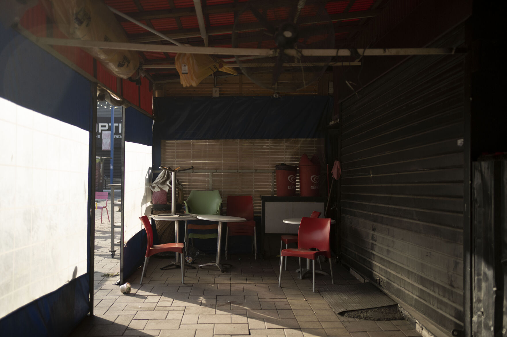<p>Tables and chairs sit idle at a restaurant that has closed due to Israel's war with Hamas on Oct. 25 in Sderot, Israel.</p>