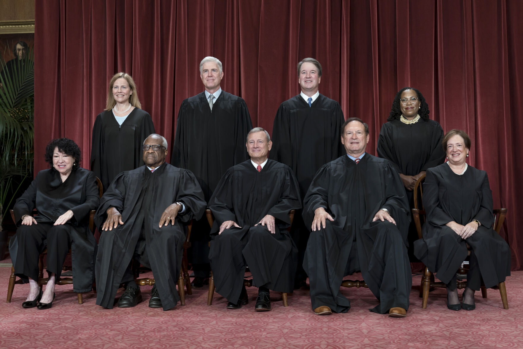 <p>FILE - Members of the Supreme Court sit for a new group portrait following the addition of Associate Justice Ketanji Brown Jackson, at the Supreme Court building in Washington, Oct. 7, 2022. Bottom row, from left, Justice Sonia Sotomayor, Justice Clarence Thomas, Chief Justice John Roberts, Justice Samuel Alito, and Justice Elena Kagan. Top row, from left, Justice Amy Coney Barrett, Justice Neil Gorsuch, Justice Brett Kavanaugh, and Justice Ketanji Brown Jackson. The Supreme Court is adopting its first code of ethics, in the face of sustained criticism over undisclosed trips and gifts from wealthy benefactors to some justices. The policy was issued by the court Monday. </p>