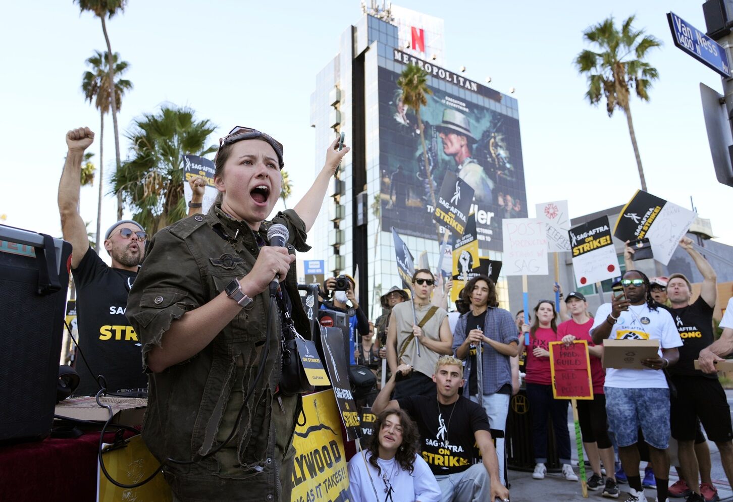 <p>SAG-AFTRA captain Mary M. Flynn rallies fellow striking actors on a picket line Wednesday outside Netflix studios in Los Angeles. </p>