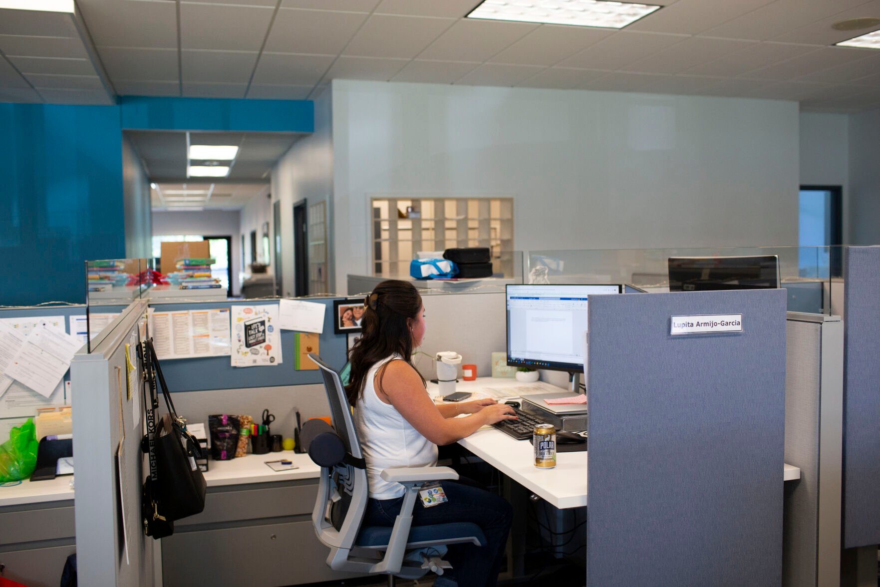 <p>File - Social worker Lupita Armijo-Garcia works at her desk in the Ottawa County, Mich., Department of Public Health office, Tuesday, Sept. 5, 2023, in Holland, Mich. On Friday, the U.S. government issues its November jobs report. (AP Photo/Kristen Norman, File)</p>