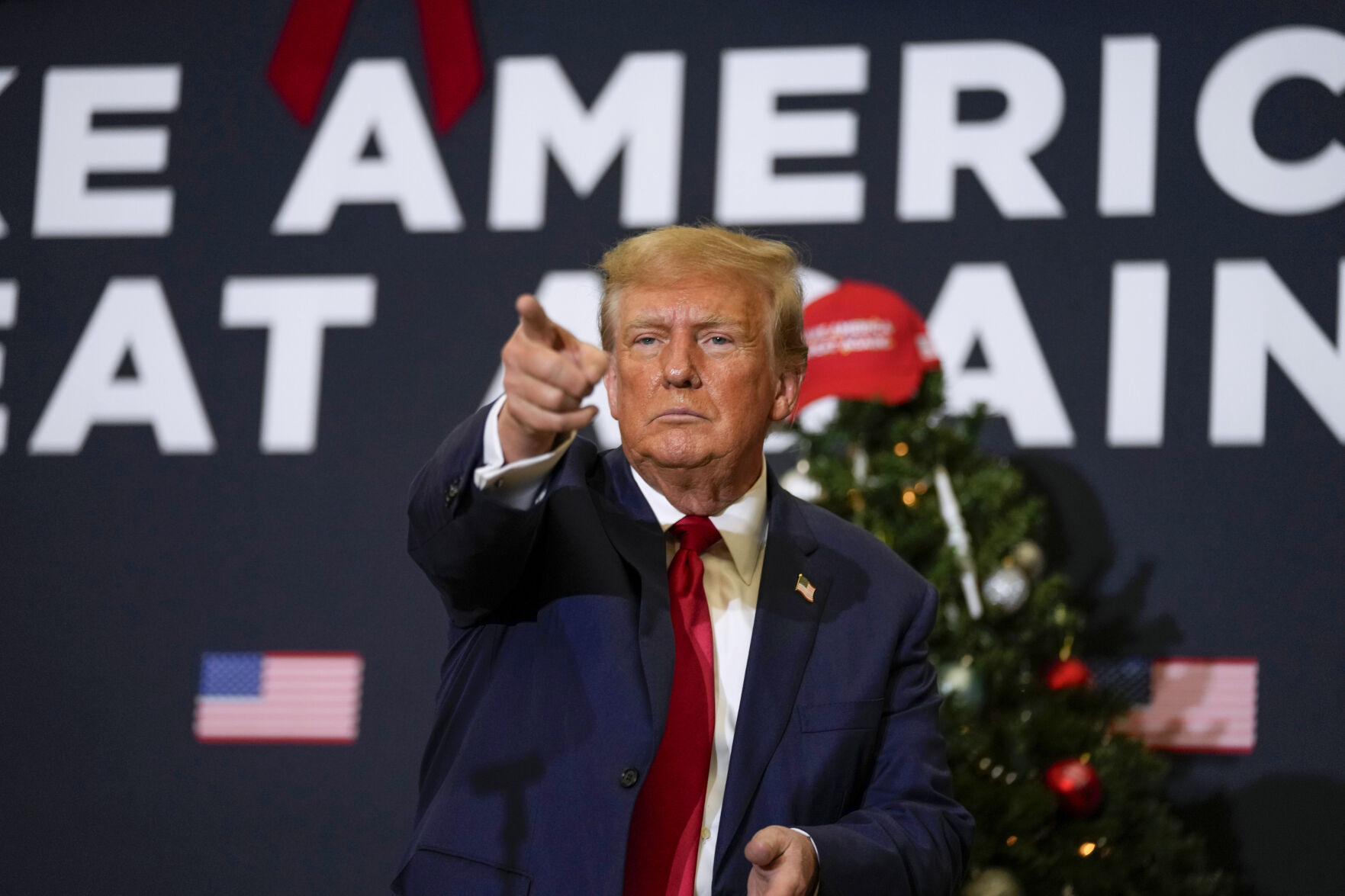 <p>Former President Donald Trump points to supporters during rally Dec. 19 in Waterloo, Iowa. <span>The Supreme Court will decide whether former President Donald Trump can be kept off the 2024 presidential ballot because of his efforts to overturn his 2020 election loss that culminated in the U.S. Capitol attack.</span></p>