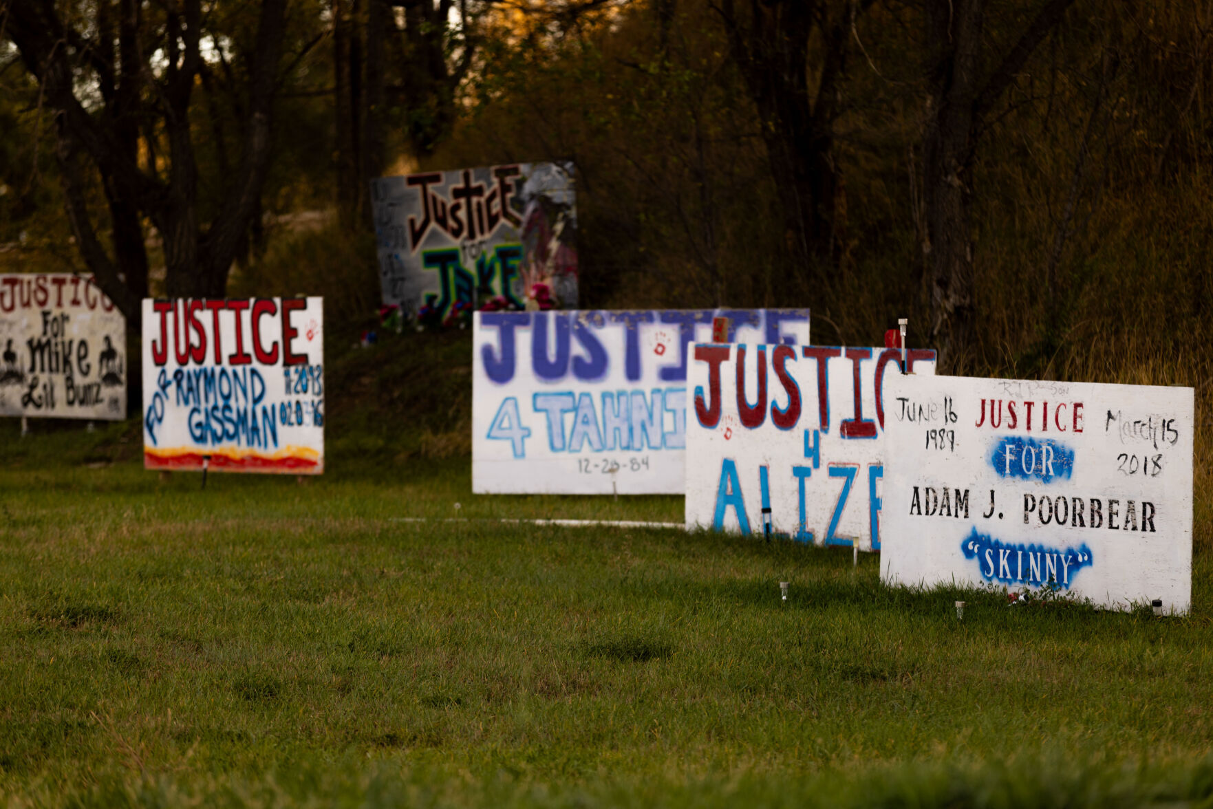 <p>Painted memorial signs for people who were killed are posted alongside Sioux Boulevard in Rosebud, S.D., on the Rosebud Indian Reservation on Monday, Oct. 16, 2023.</p>