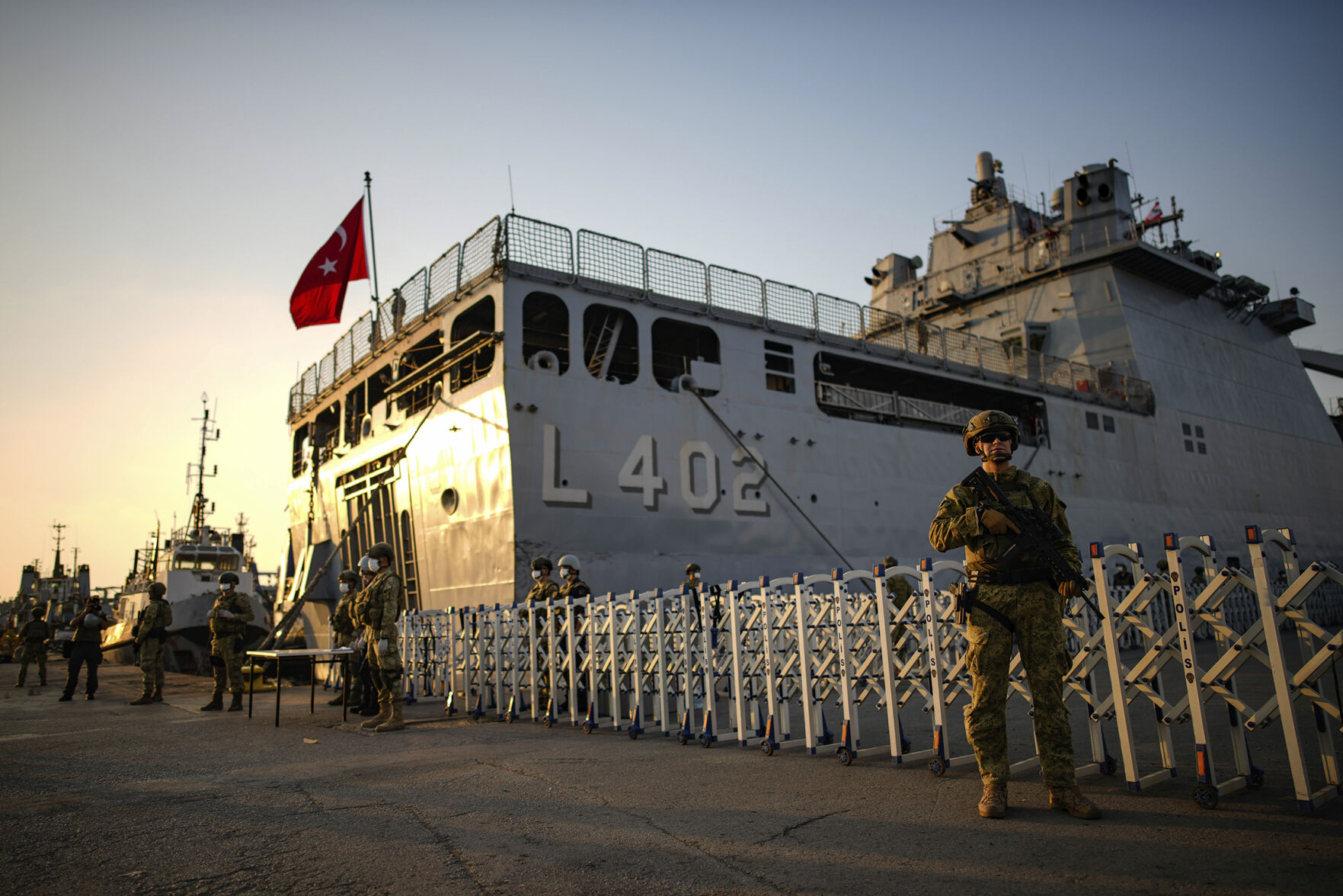 <p>Turkish security personnel guard Turkish military ships preparing to evacuate citizens from Lebanon to Turkey on Wednesday in Beirut.</p>