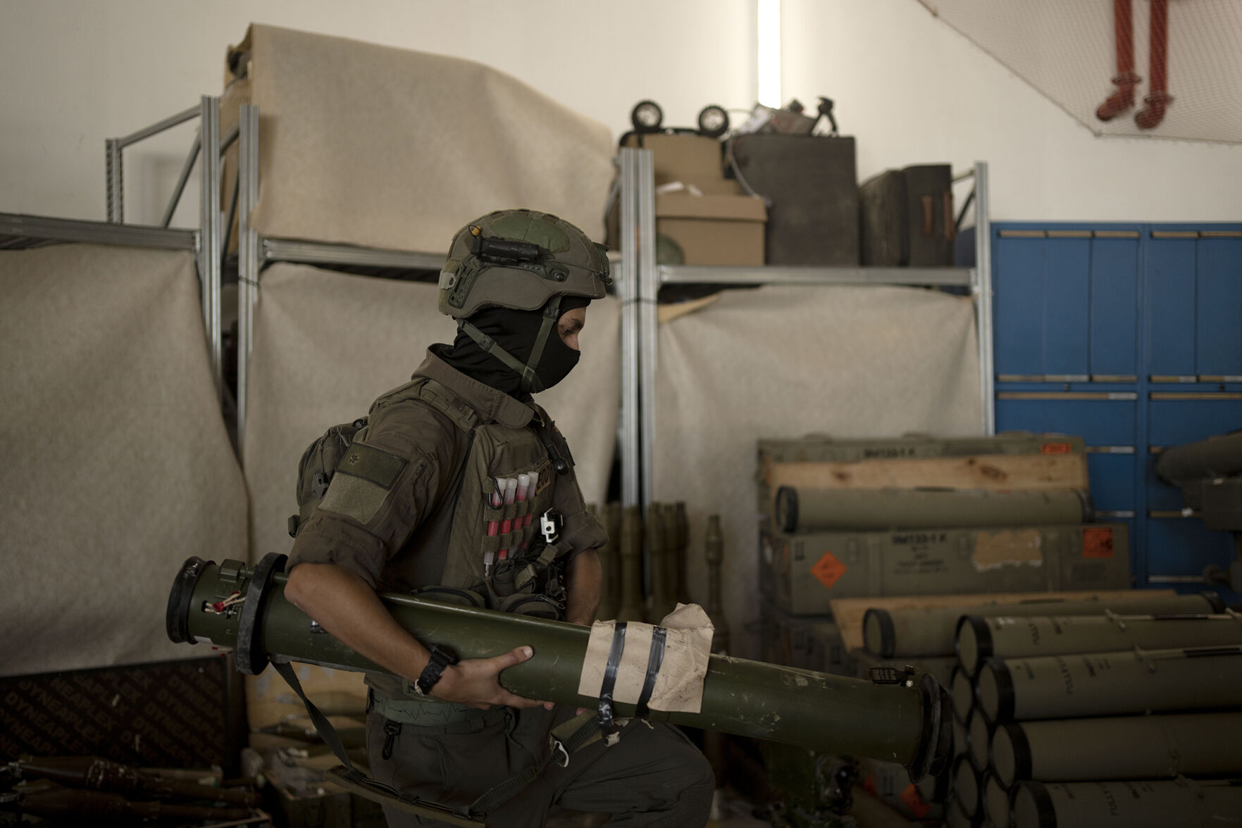 <p>An Israeli soldier moves a weapon seized during combat operations in Lebanon and displayed Wednesday during a government-organized media tour on a base in southern Israel.</p>