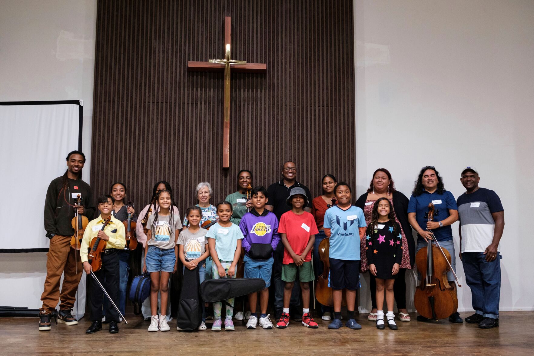 <p>A string orchestra, part of an initiative to promote equity in classical music, poses for a group photo at New Hope Presbyterian Church on Oct. 16 in Anaheim, Calif.</p>