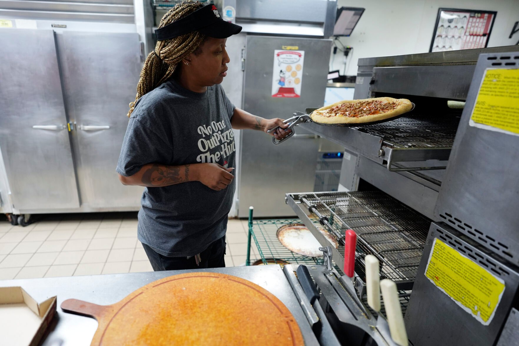 <p>TiAnna Yeldell, a 44-year-old single mom of three, works in the kitchen at Pizza Hut on Nov. 14, 2024, in Missouri City, Texas. </p>