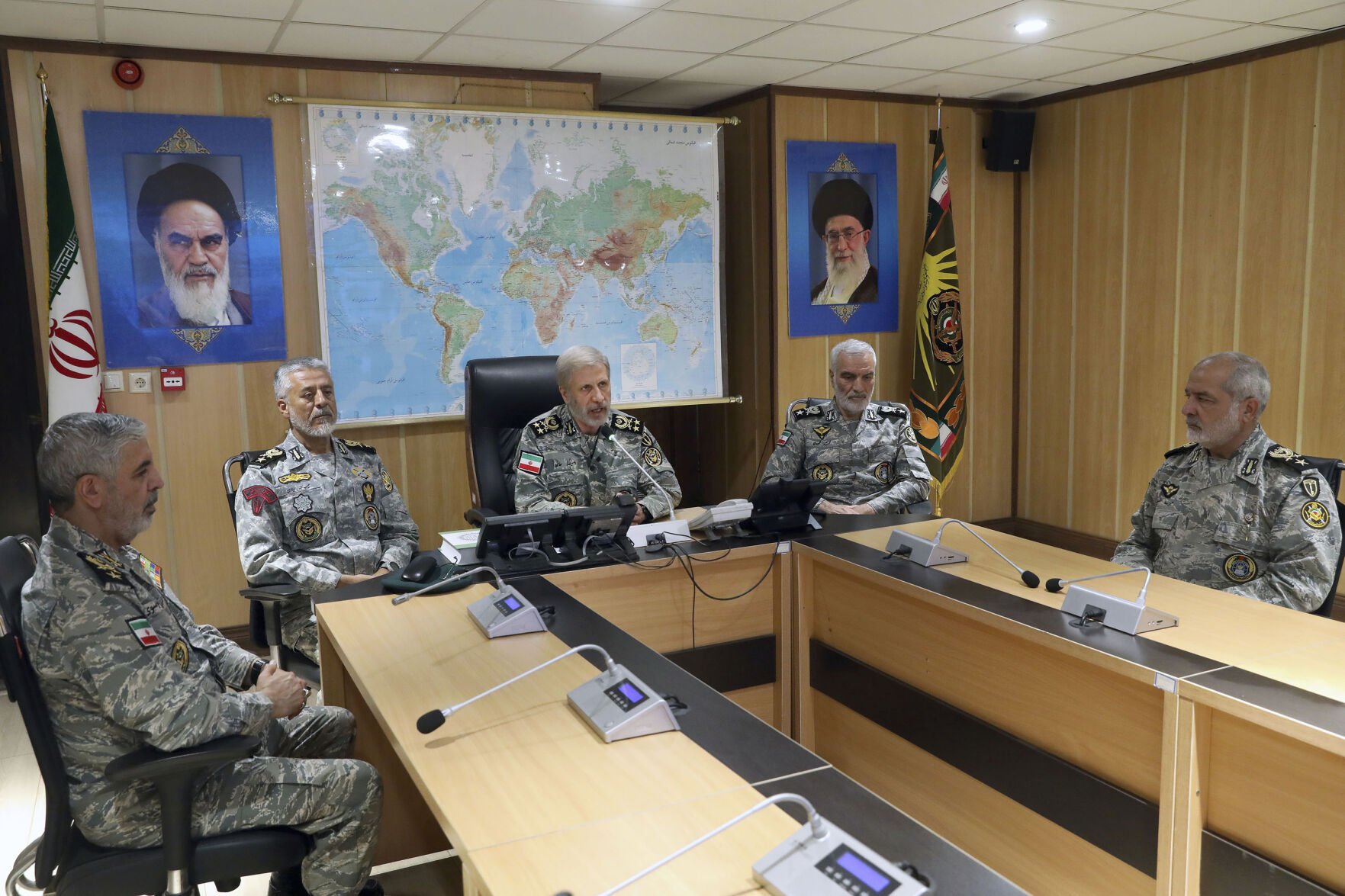<p>In this photo released on Monday, June 23, 2025, by Iranian army press service, Iran's army commander-in-chief Gen. Amir Hatami, center, accompanied by high ranked army commanders, speaks in a video call with top commanders of the army, in Zolfaghar central headquarters, Iran, as portraits of the late revolutionary founder Ayatollah Khomeini, left, and Supreme Leader Ayatollah Ali Khamenei hang on the wall. (Iranian Army Press Service via AP)</p>