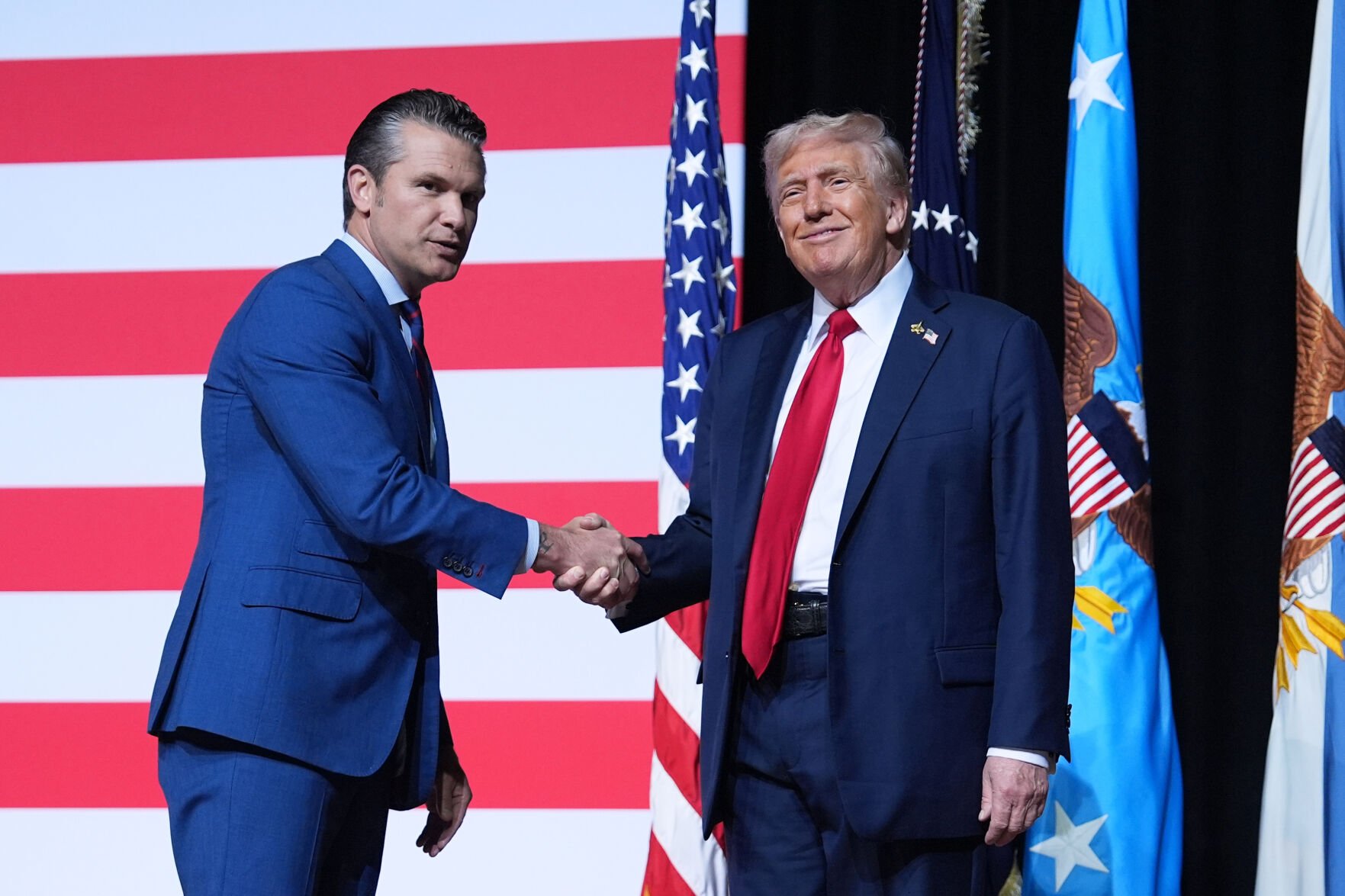 <p>President Donald Trump is greeted by Secretary of Defense Pete Hegseth before speaking to a gathering of top U.S. military commanders at Marine Corps Base Quantico, Sept. 30, in Quantico, Va. </p>