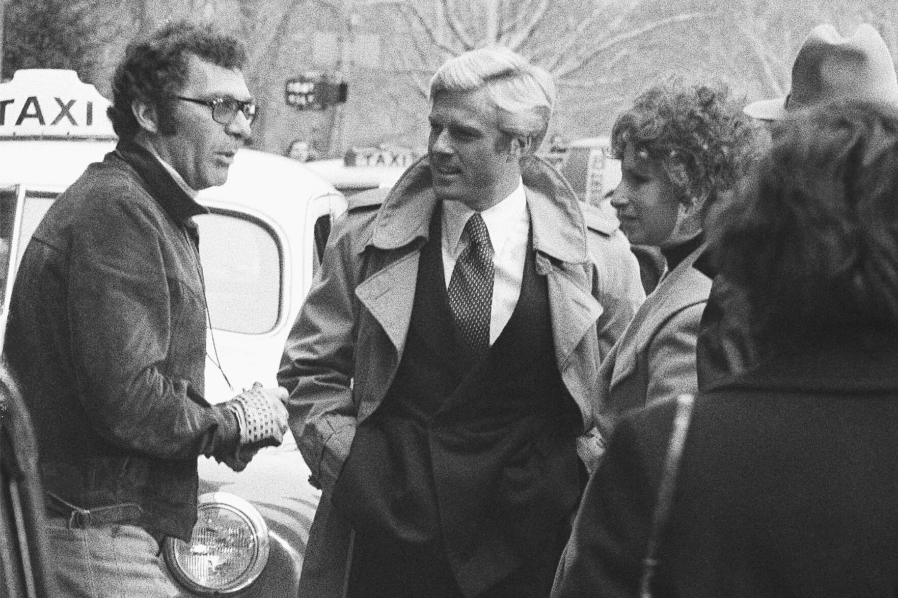 <p>Director Sydney Pollack, left, appears with actors Robert Redford, center, and Barbra Streisand during the filming of "The Way We Were" on Nov. 28, 1972, in New York.</p>