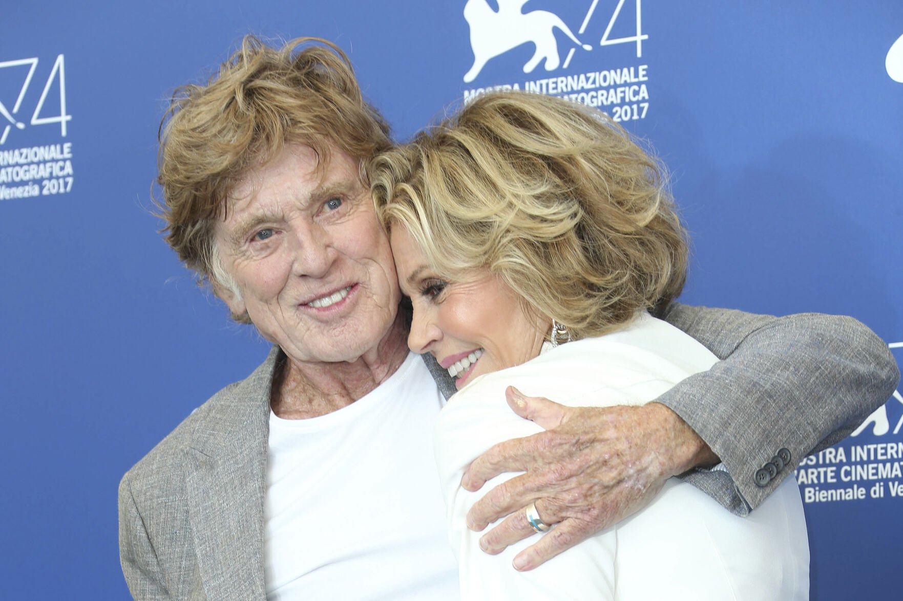 <p>Actors Robert Redford and Jane Fonda hug as they pose for photographers at the photo call of the film "Our Souls at Night" during the 74th edition of the Venice Film Festival on Sept. 1, 2017, in Venice, Italy. </p>