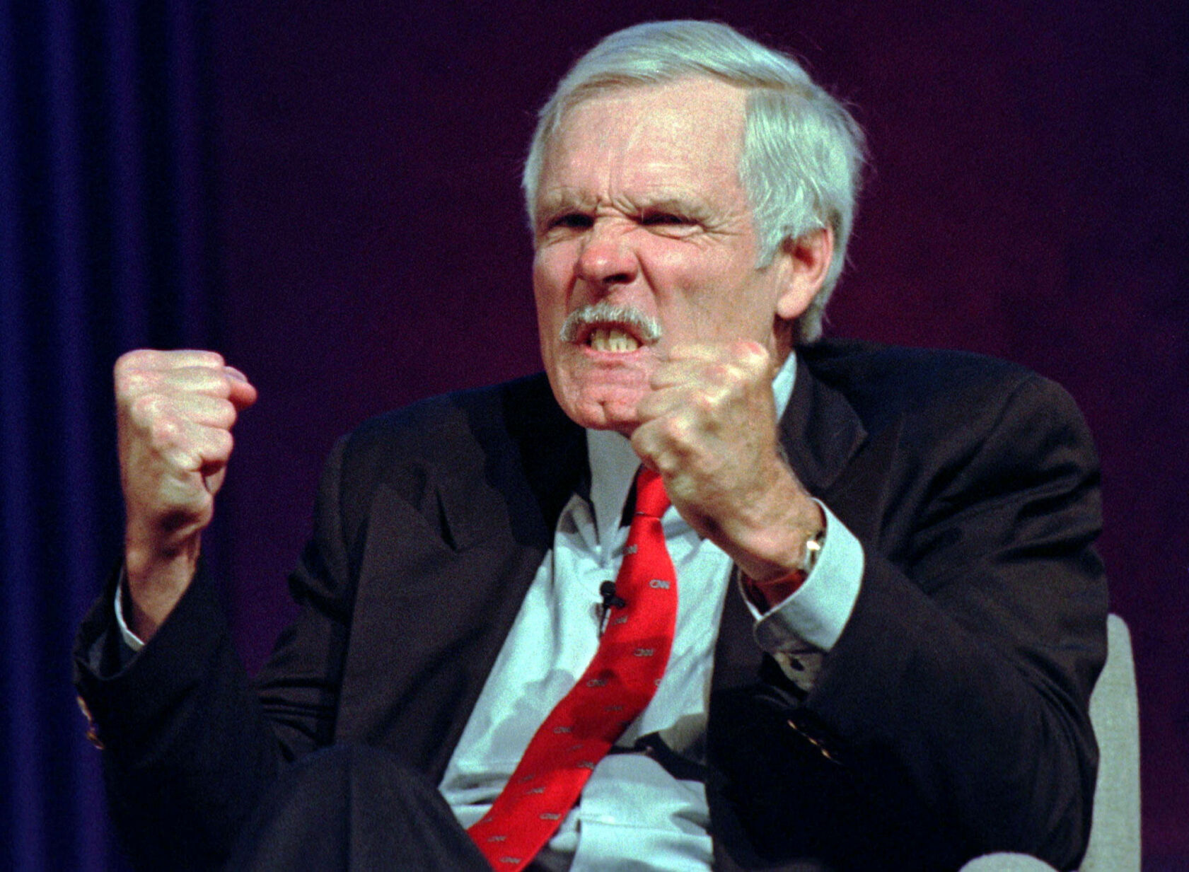 <p>Time Warner Inc. Vice Chairman Ted Turner gestures Dec. 12, 1996, after the moderator of a panel discussion at the Western Cable Show mentioned the name of Rupert Murdoch, head of News Corp Ltd., in Anaheim, Calif.</p>