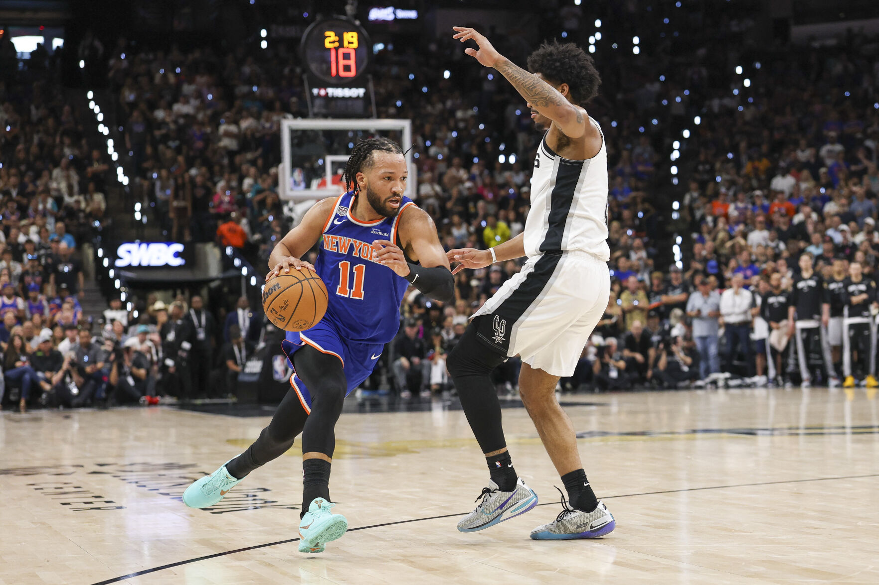 <p>New York Knicks guard Jalen Brunson moves the ball to the basket against the San Antonio Spurs during the first quarter in Game 5 of the NBA Finals on Saturday at Frost Bank Center in San Antonio.</p>