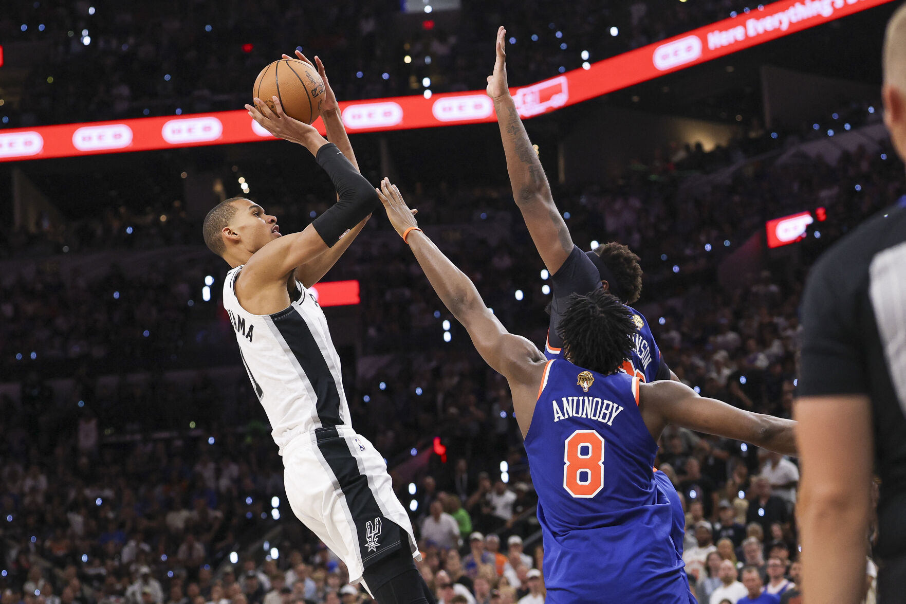 <p>San Antonio Spurs forward Victor Wembanyama shoots the ball over New York Knicks forward Og Anunoby during the third quarter in Game 5 of the NBA Finals on Saturday at Frost Bank Center in San Antonio.</p>
