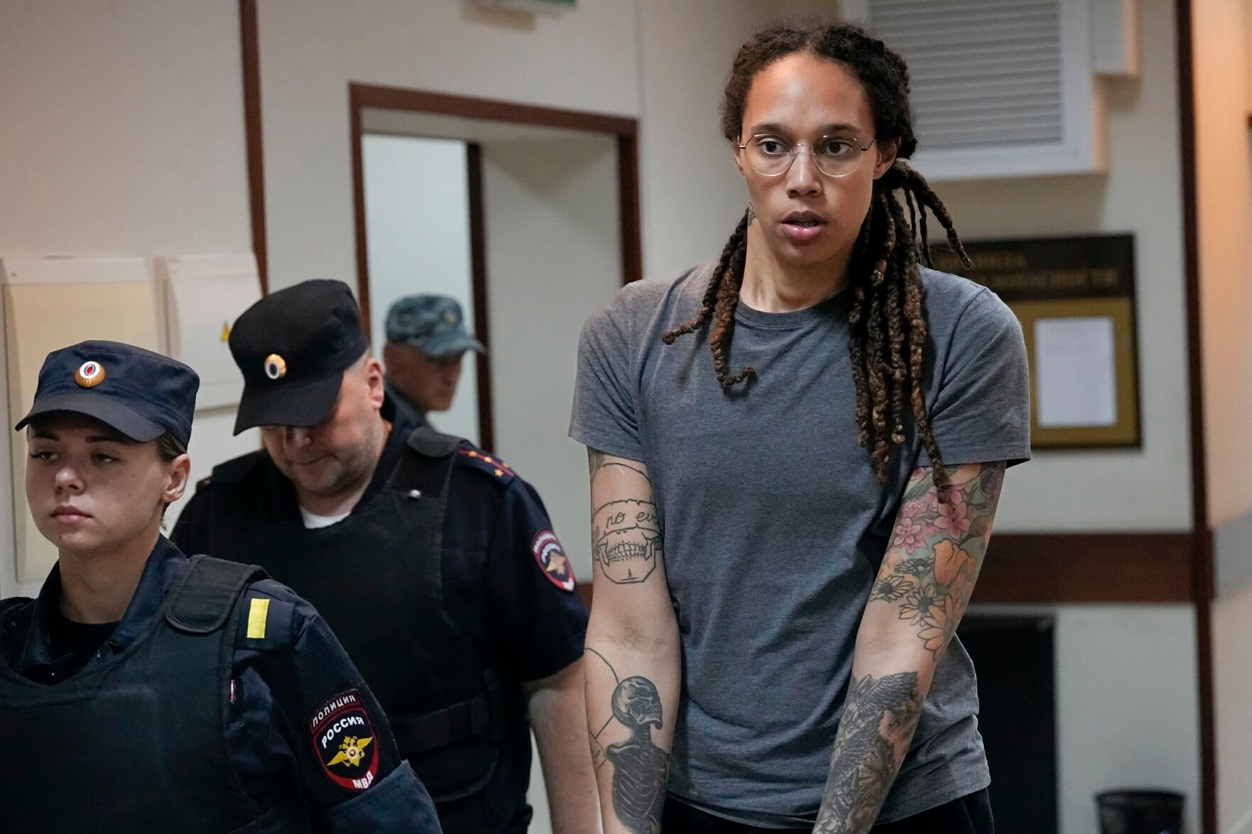 <p>FILE - WNBA star and two-time Olympic gold medalist Brittney Griner is escorted from a courtroom after a hearing in Khimki just outside Moscow, on Aug. 4, 2022. </p>