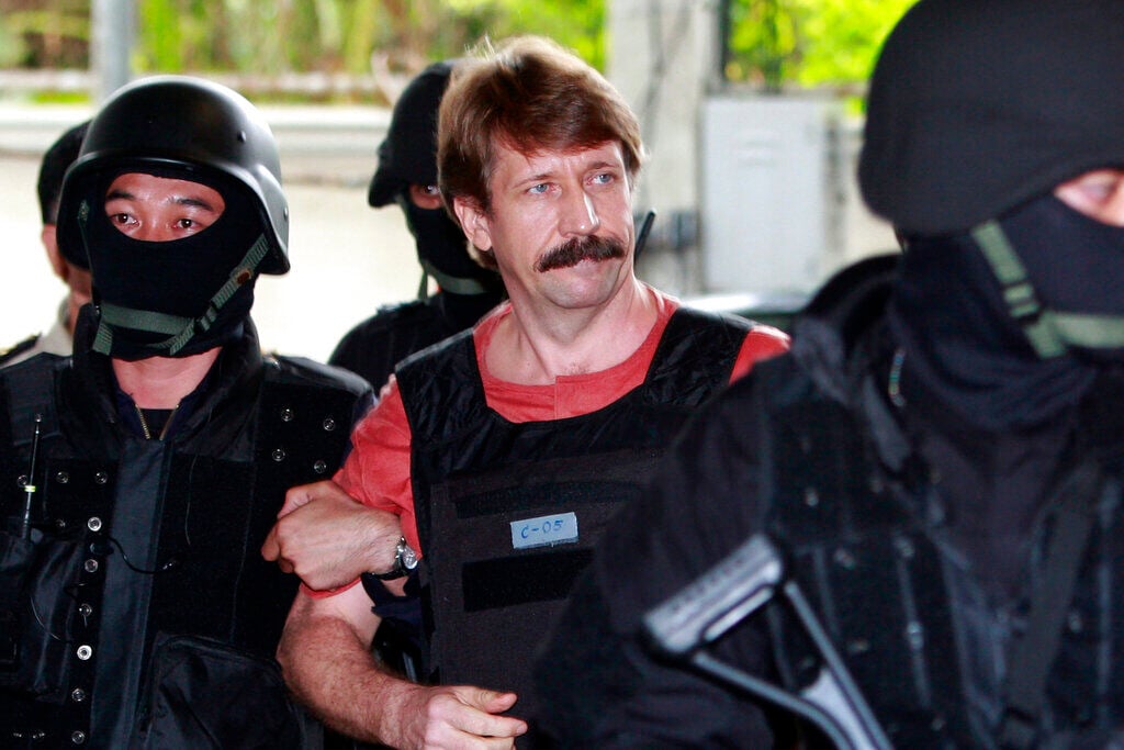 <p>FILE - Suspected Russian arms smuggler Viktor Bout, center, is led by armed Thai police commandos as he arrives at the criminal court in Bangkok, Thailand in Oct. 5, 2010. </p>
