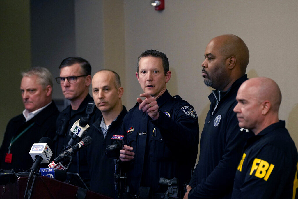 <p>Michigan State University Interim Deputy Police Chief Chris Rozman, center, joins law enforcement officials while addressing the media, Tuesday, Feb. 14, 2023, in East Lansing, Mich. Police said a man suspected of killing several people and wounding others at the university on Monday night has died. Police said the man apparently shot himself off campus. (AP Photo/Carlos Osorio)</p>