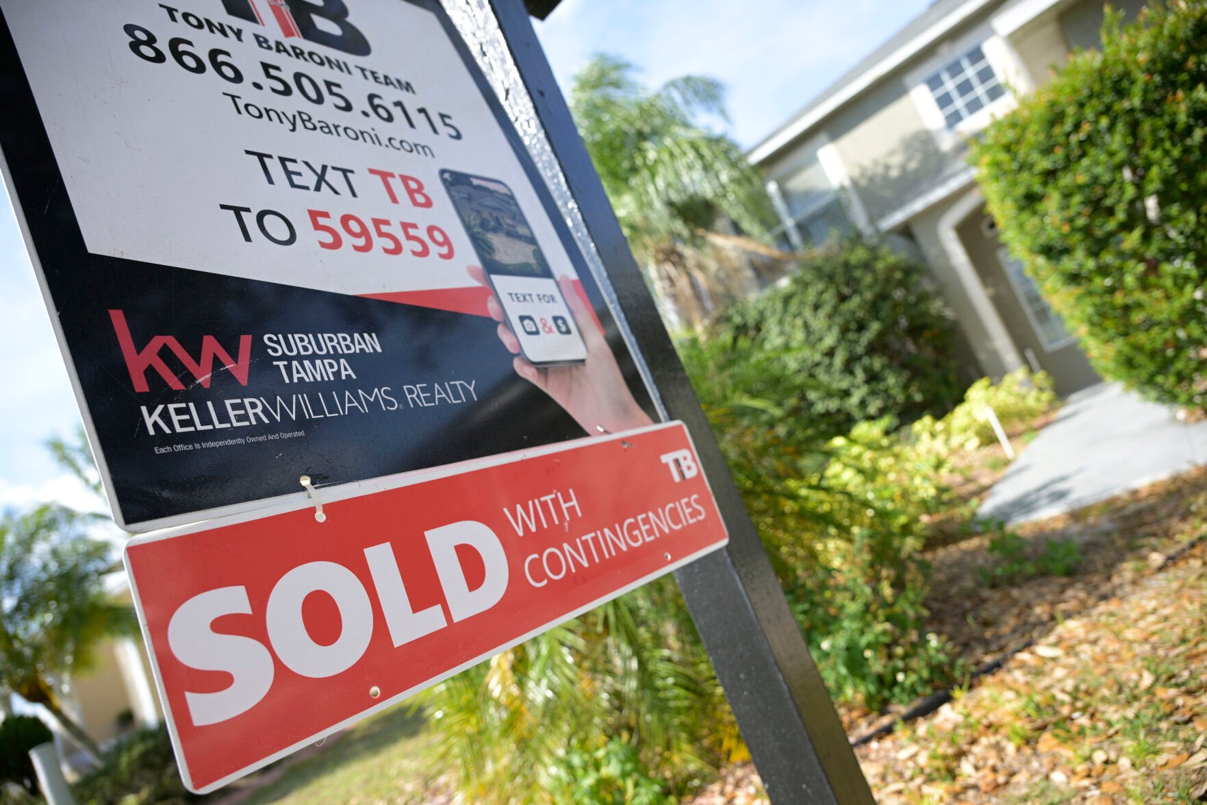<p>A real estate sign is posted outside of a recently sold home, Tuesday, Feb. 21, 2023, in Valrico, Fla.</p>