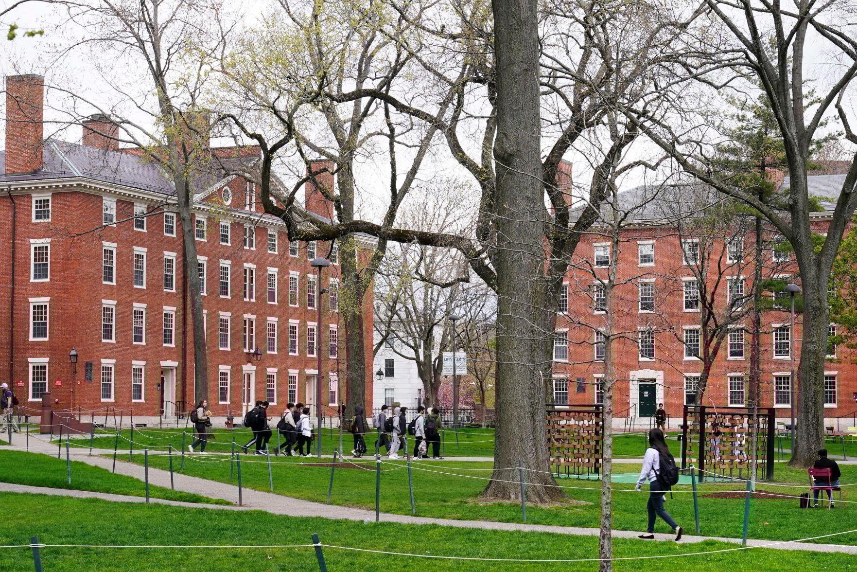 <p>FILE - Students walk through Harvard Yard, April 27, 2022, on the campus of Harvard University in Cambridge, Mass. </p>