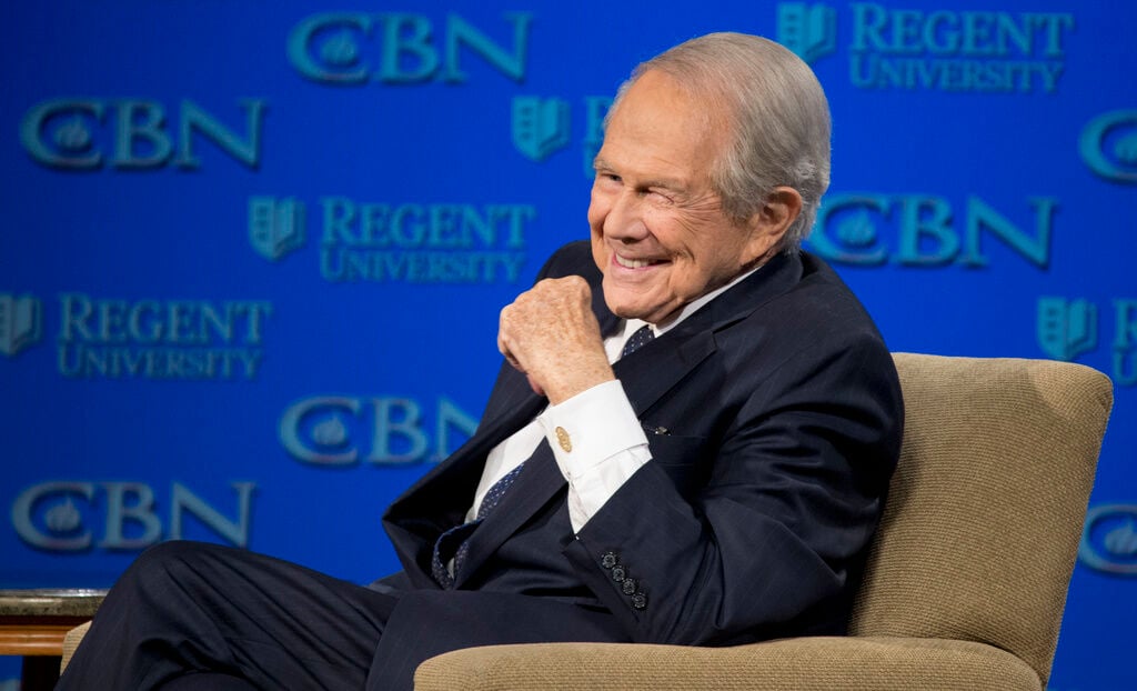 <p>FILE - Rev. Pat Robertson listens as Republican presidential candidate Donald Trump speaks at Regent University in Virginia Beach, Va., Feb. 24, 2016. Robertson, a religious broadcaster who turned a tiny Virginia station into the global Christian Broadcasting Network, tried a run for president and helped make religion central to Republican Party politics in America through his Christian Coalition, has died. He was 93. Robertson's death Thursday, June 8, 2023 was announced by his broadcasting network. (AP Photo/Steve Helber, File)</p>