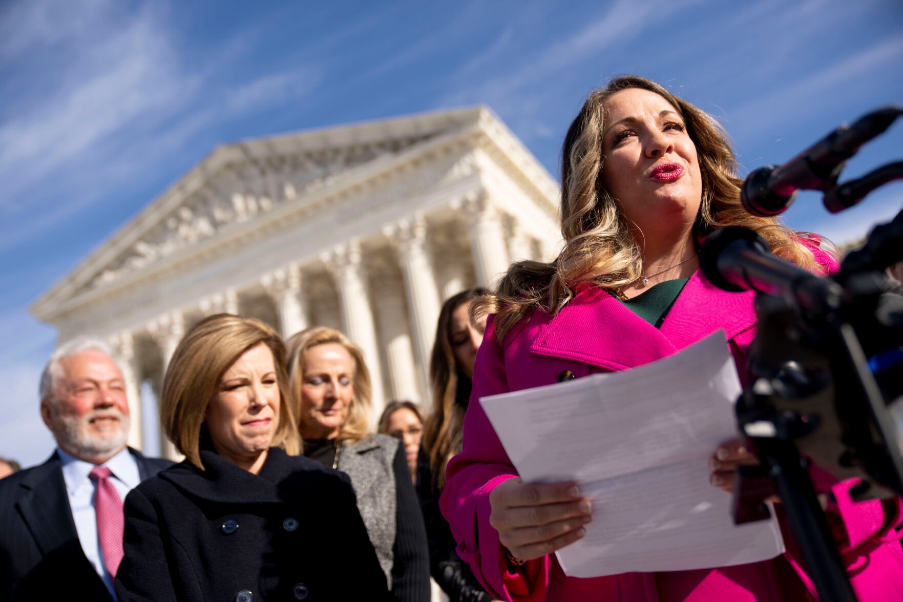 <p>FILE - Lorie Smith, a Christian graphic artist and website designer in Colorado, right, accompanied by her lawyer, Kristen Waggoner of the Alliance Defending Freedom, second from left, speaks outside the Supreme Court in Washington, Monday, Dec. 5, 2022, after her case was heard before the Supreme Court.</p>