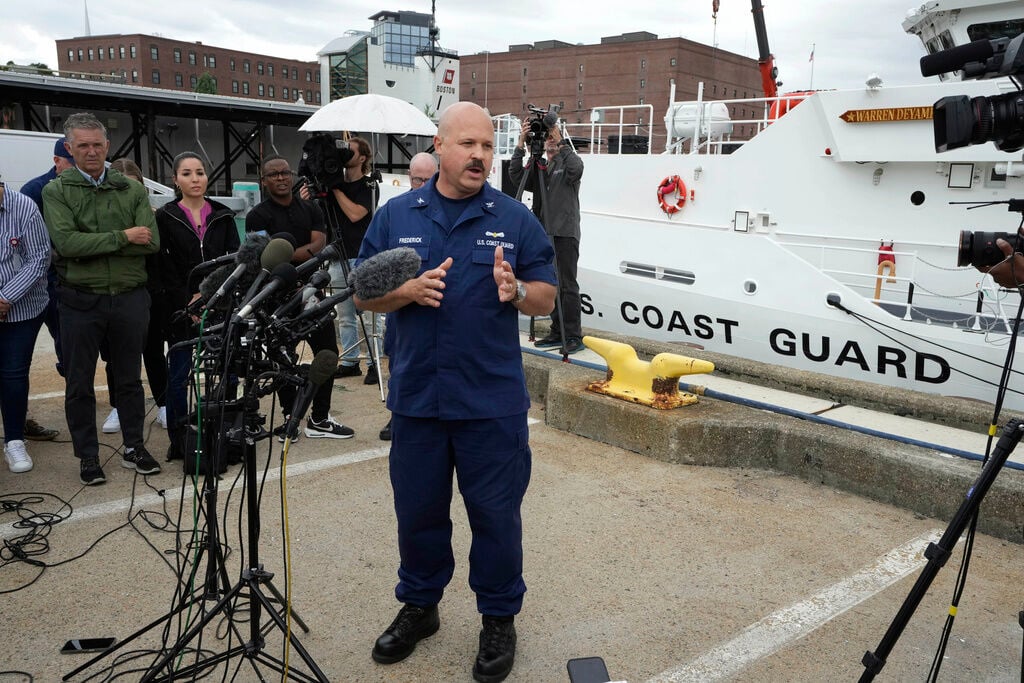 <p>U.S. Coast Guard Capt. Jamie Frederick, center, faces reporters during a news conference, Tuesday, June 20, 2023, at Coast Guard Base Boston, in Boston.</p>